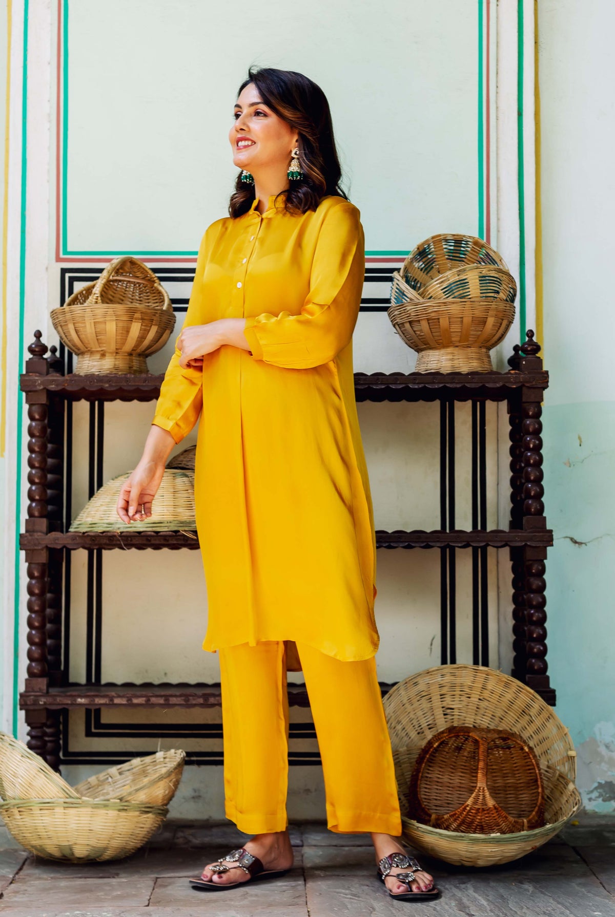 Model wears a radiant golden yellow satin coord set, full length view.