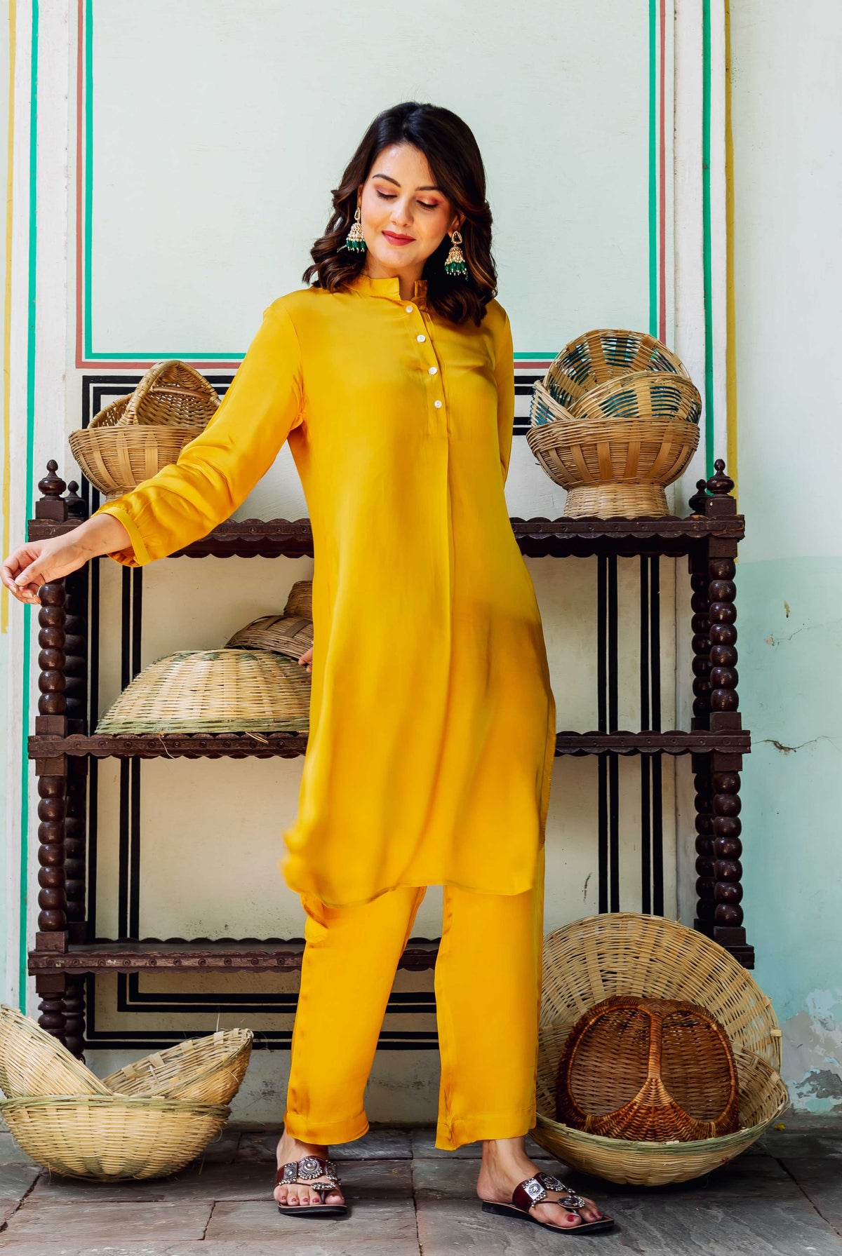 Front full look of model in vibrant golden yellow satin coord set.