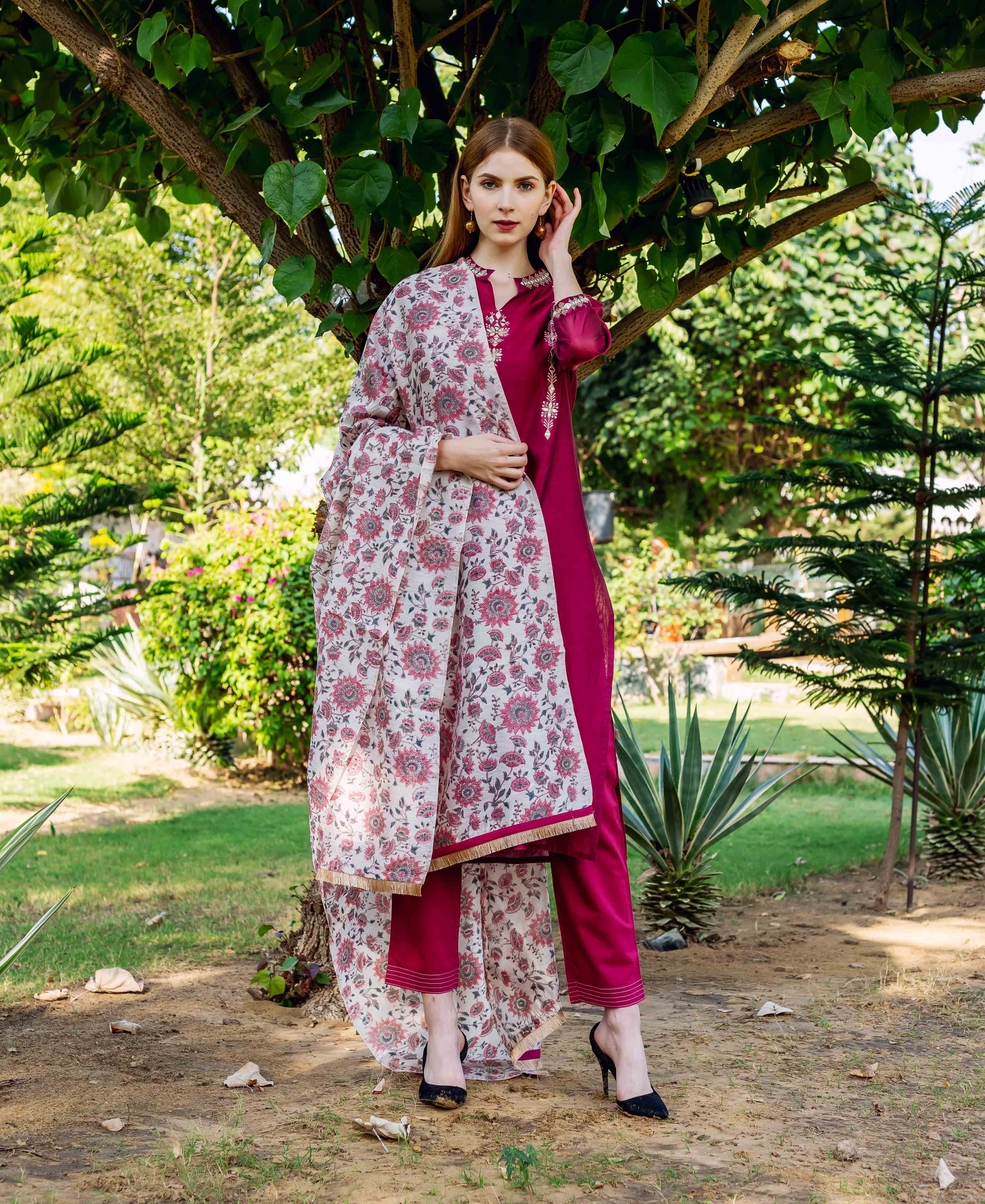 Model in magenta ethnic set, cream floral hand-block printed chanderi dupatta draped.