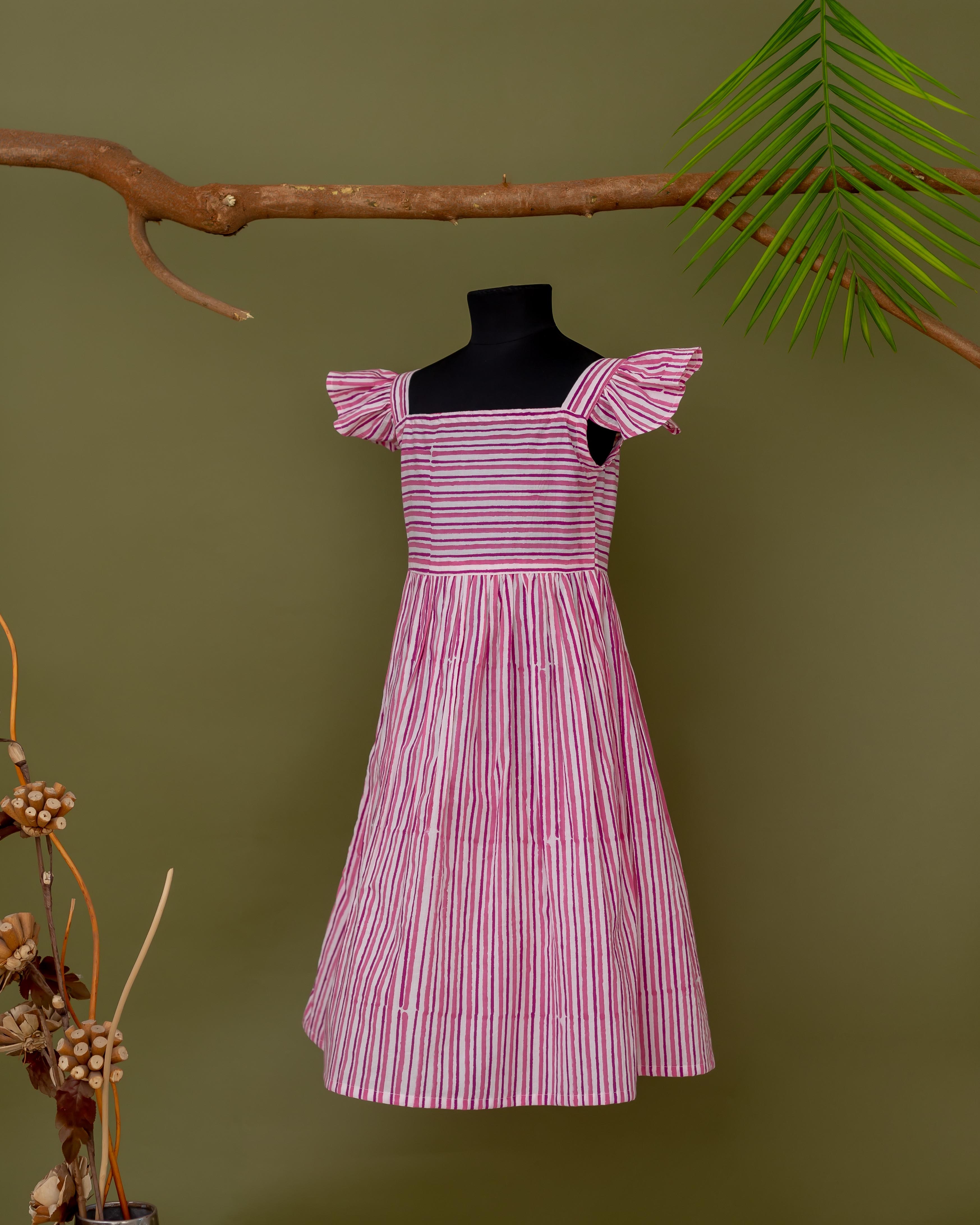 Pink and white striped hand block printed dress with ruffled sleeves and square neckline.