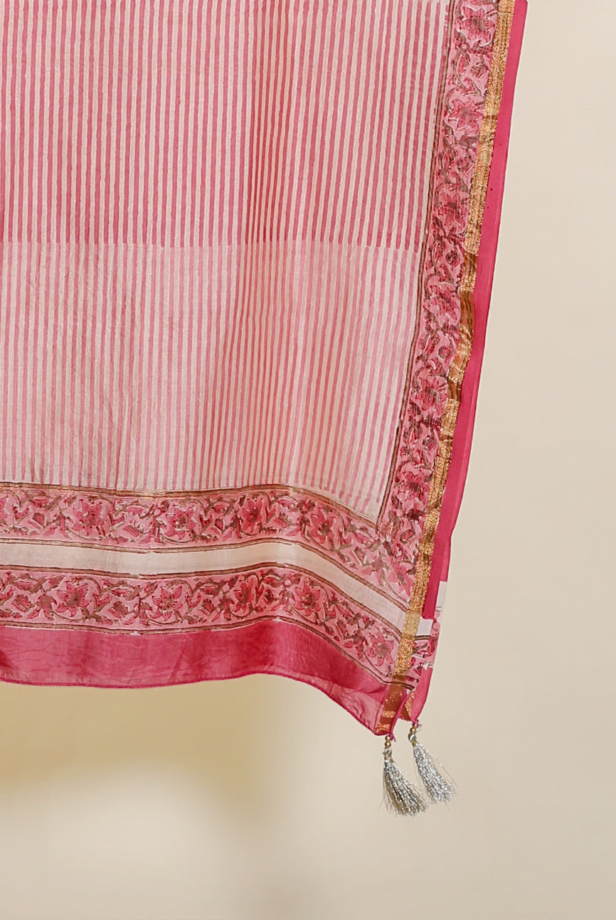 Hanging pink striped chanderi dupatta with floral border, gold trim, and silver tassels.