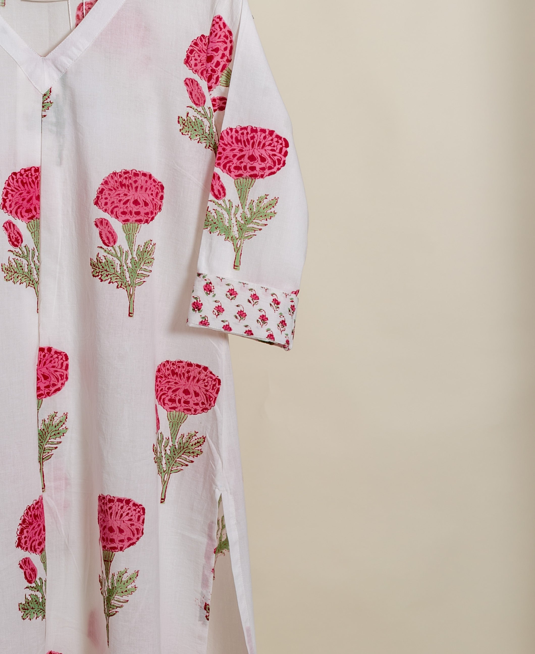 A white, hand-block-printed cotton co-ord set with pink rose designs.