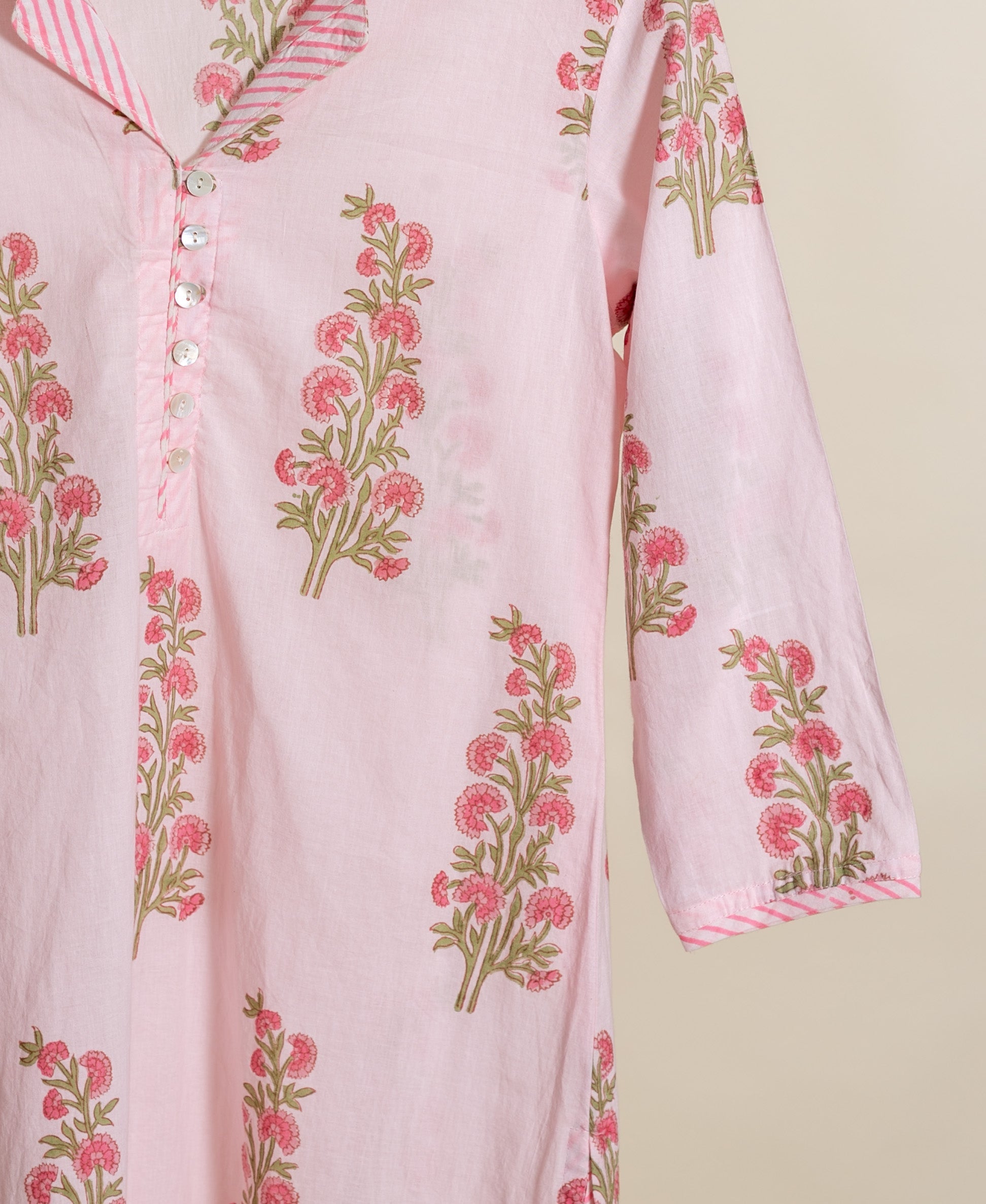 Front view of baby pink handblock floral cotton kurta, striped collar and sleeve.