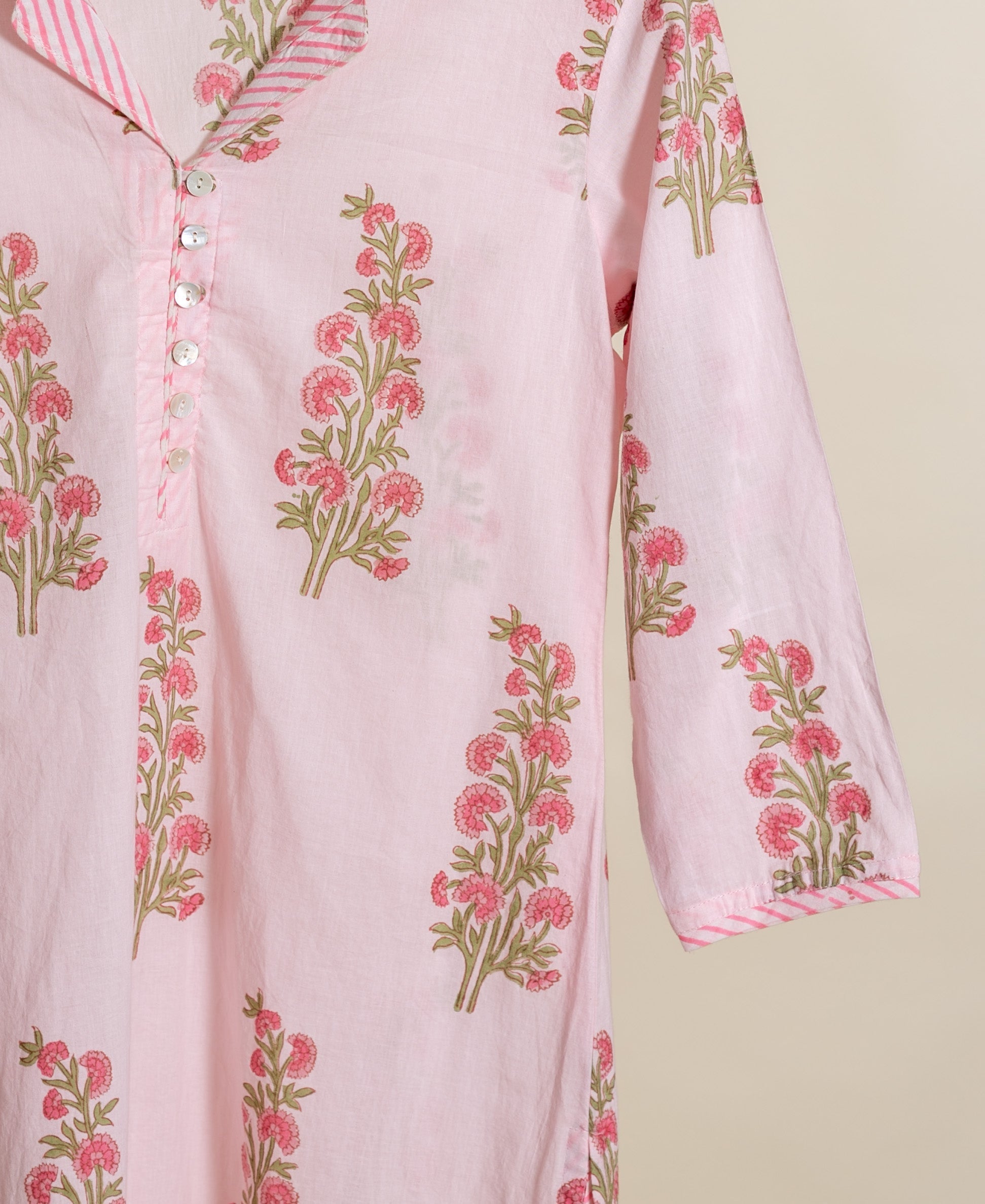 Front view of baby pink handblock floral cotton kurta, striped collar and sleeve.