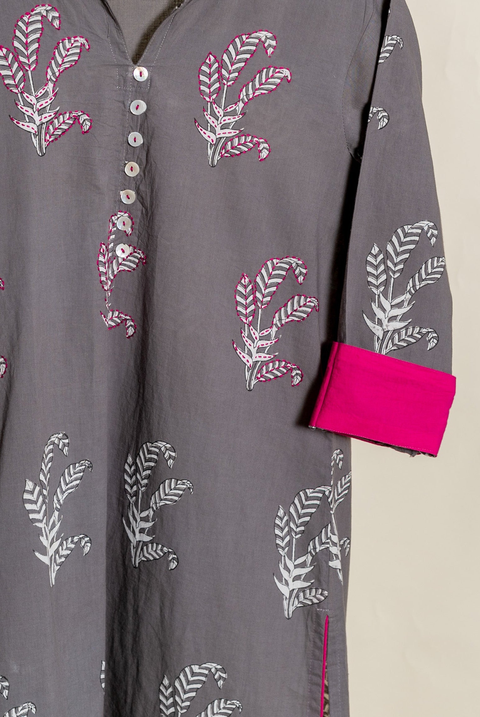 Grey hand block printed cotton cord set with pink accents and white buttons.