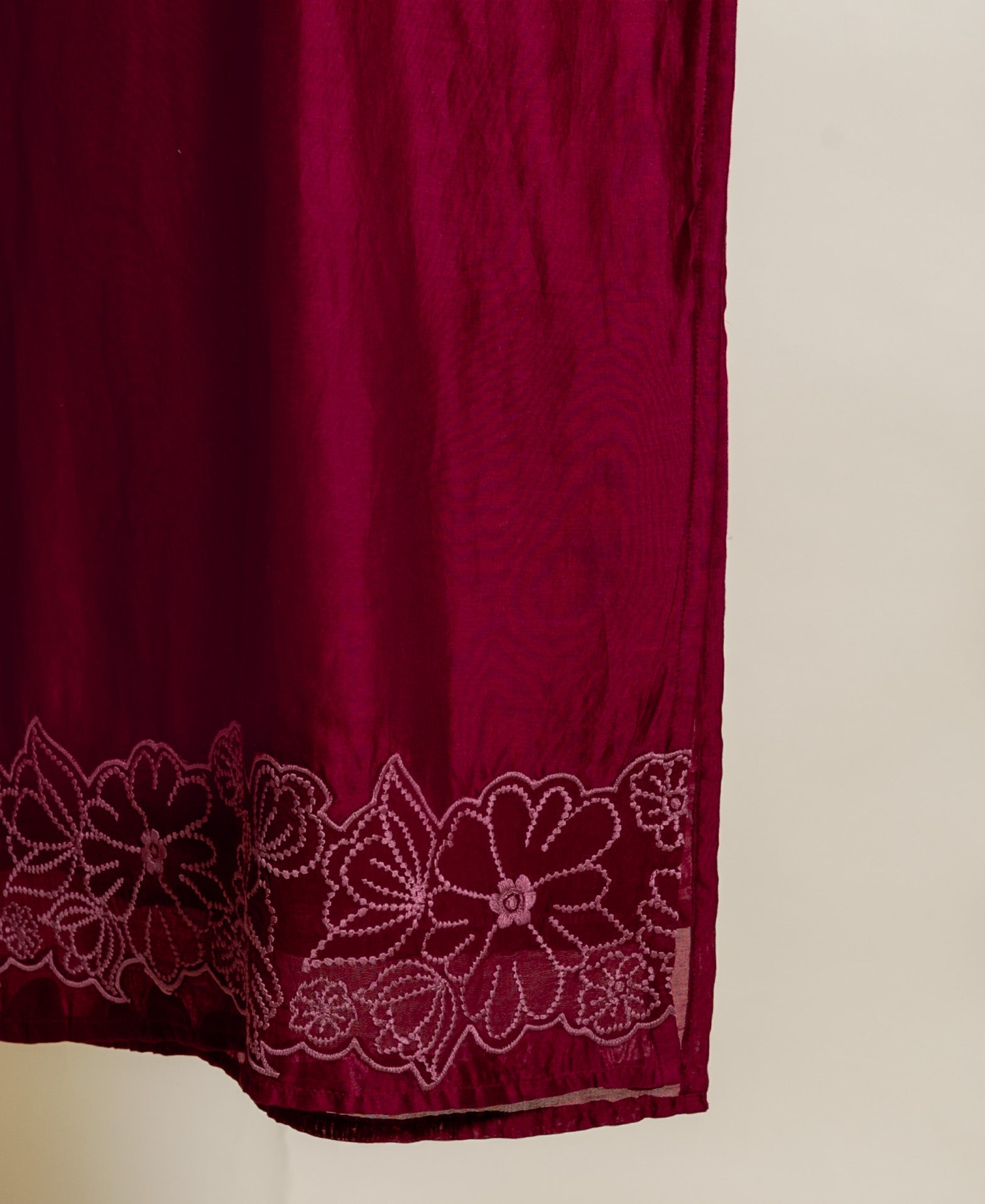 Wine red Chanderi silk kurta featuring an embroidered floral border in a lighter shade.