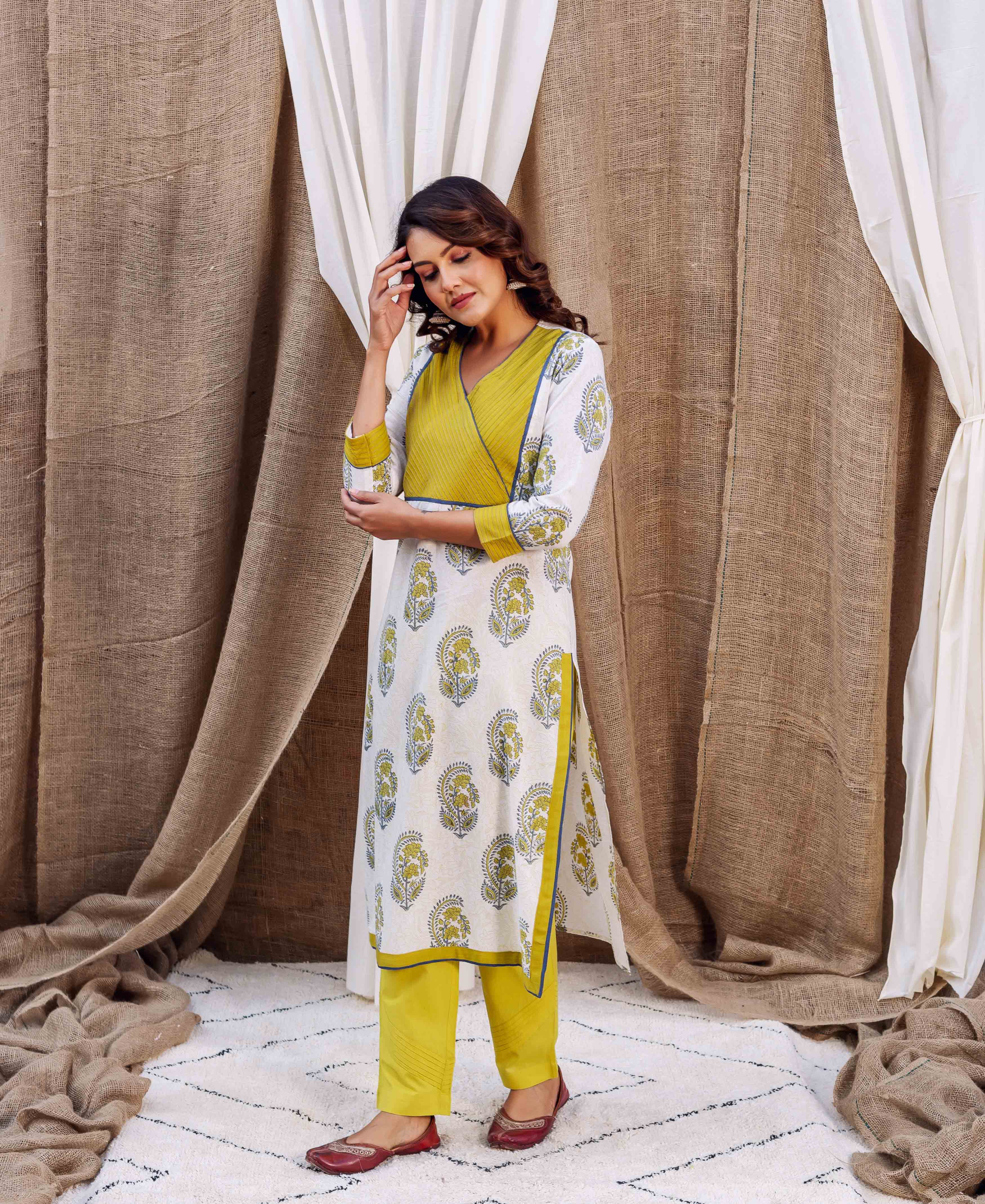 Full-length model in white block-printed kurta with yellow yoke, plain yellow pants, red flats.