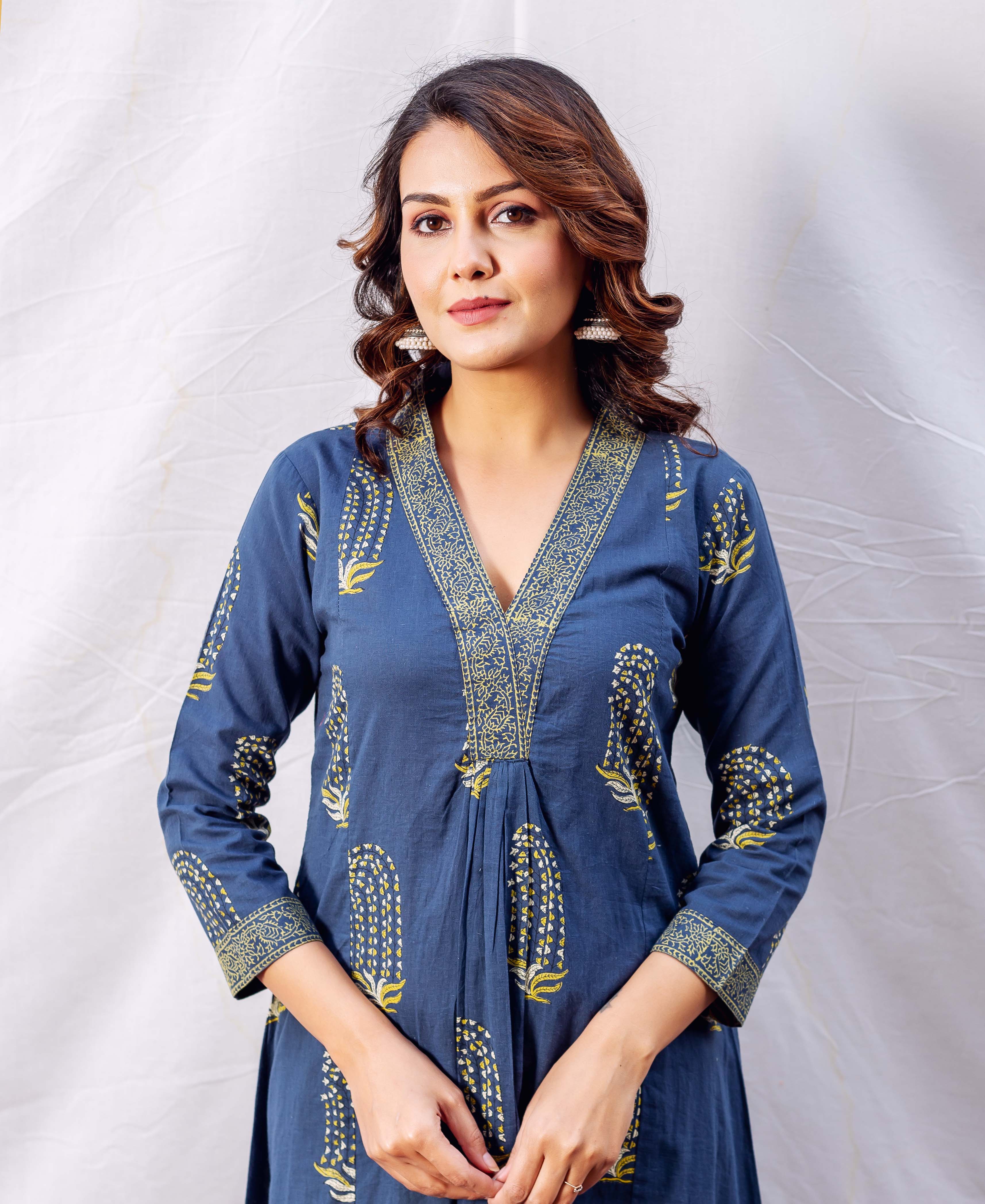 Front view of model wearing an indigo and ochre block printed A-line kurta.
