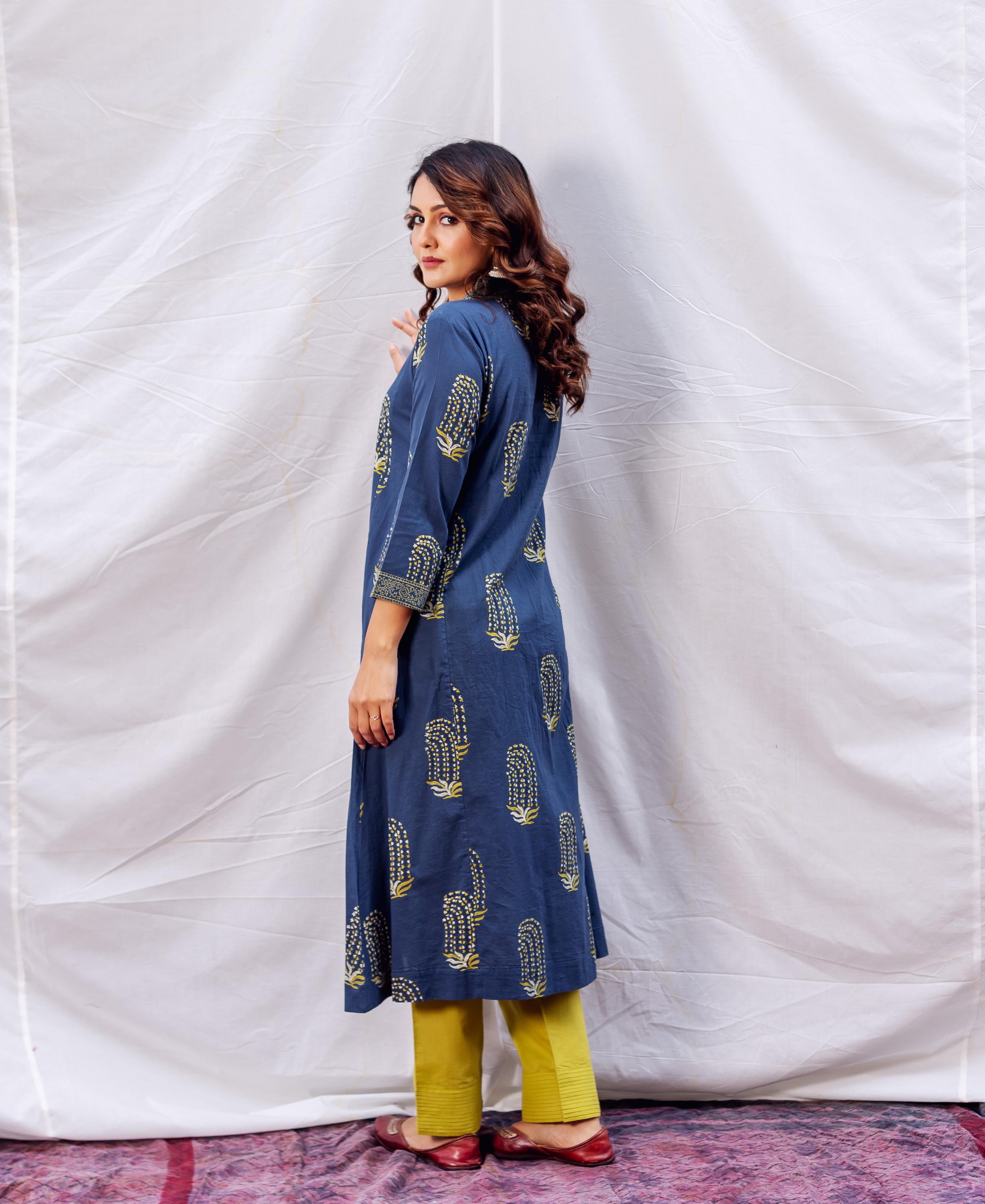 Model wears full look, side view, indigo and ochre block printed A-line kurta.