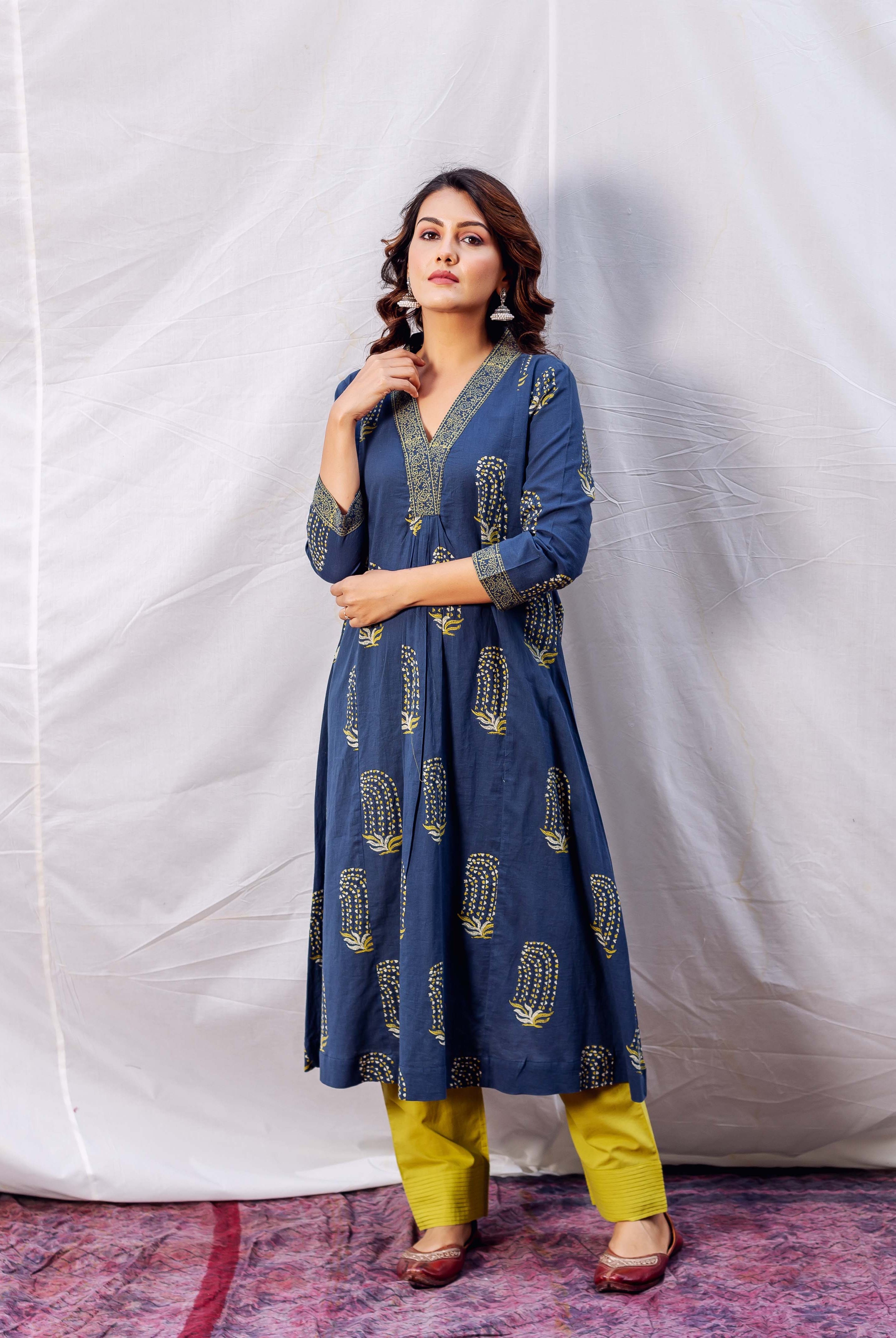 A model wearing an indigo and ochre block-printed A-line kurta.