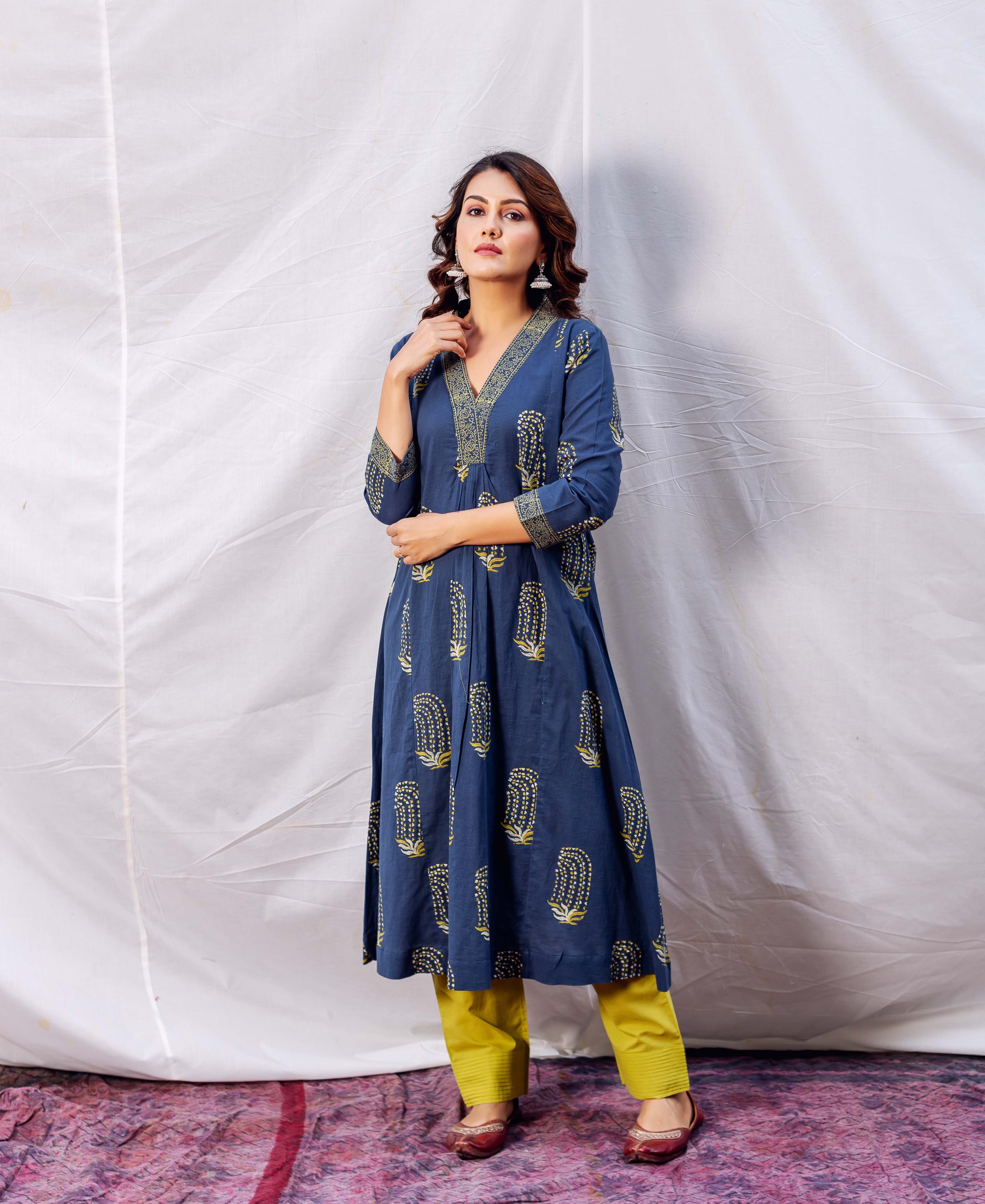 A model wearing an indigo and ochre block-printed A-line kurta.