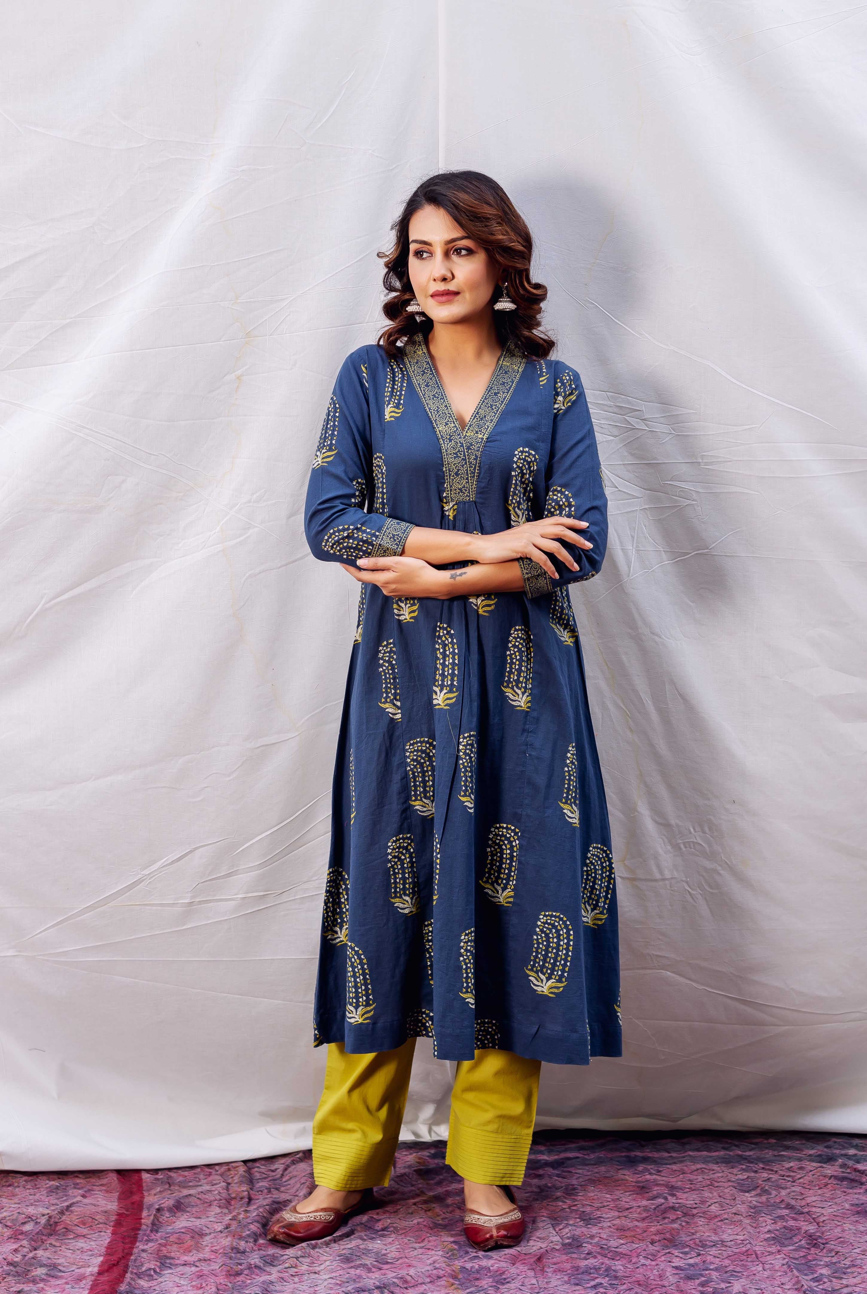 A model wearing a blue and yellow block-printed kurta with a V-neckline.