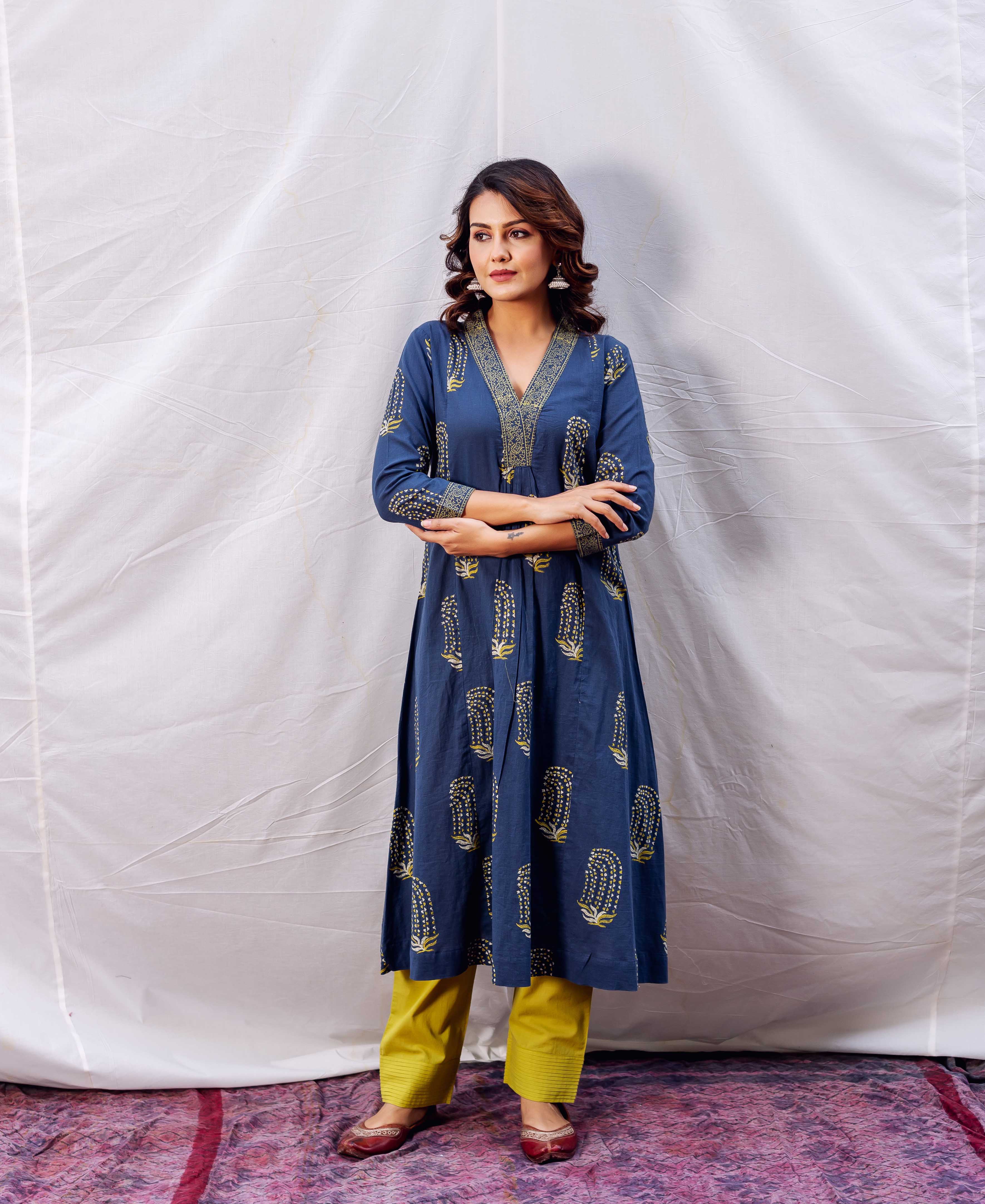 A model wearing a blue and yellow block-printed kurta with a V-neckline.