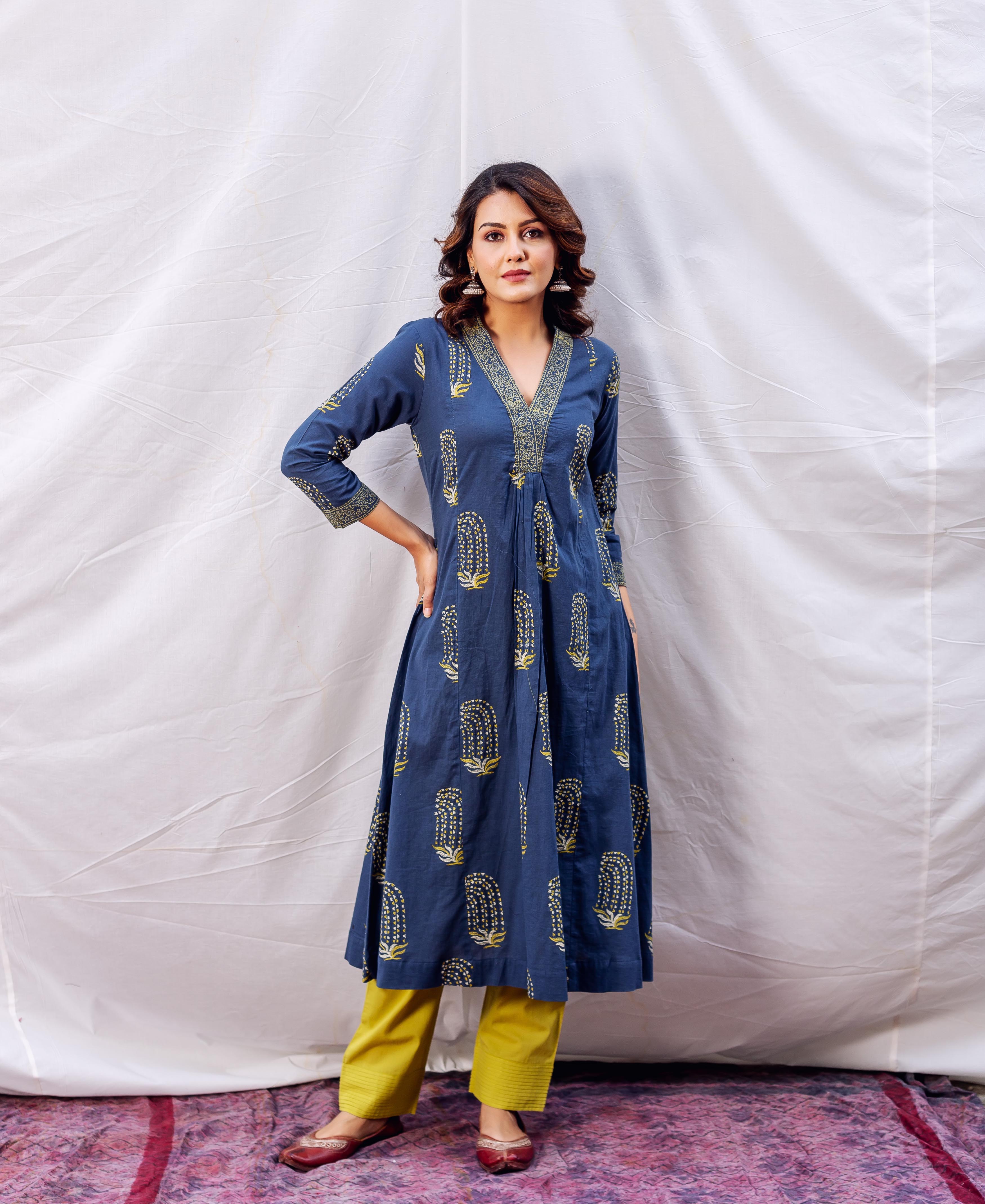 Front view model wearing indigo ochre block printed A-line kurta with yellow pants.
