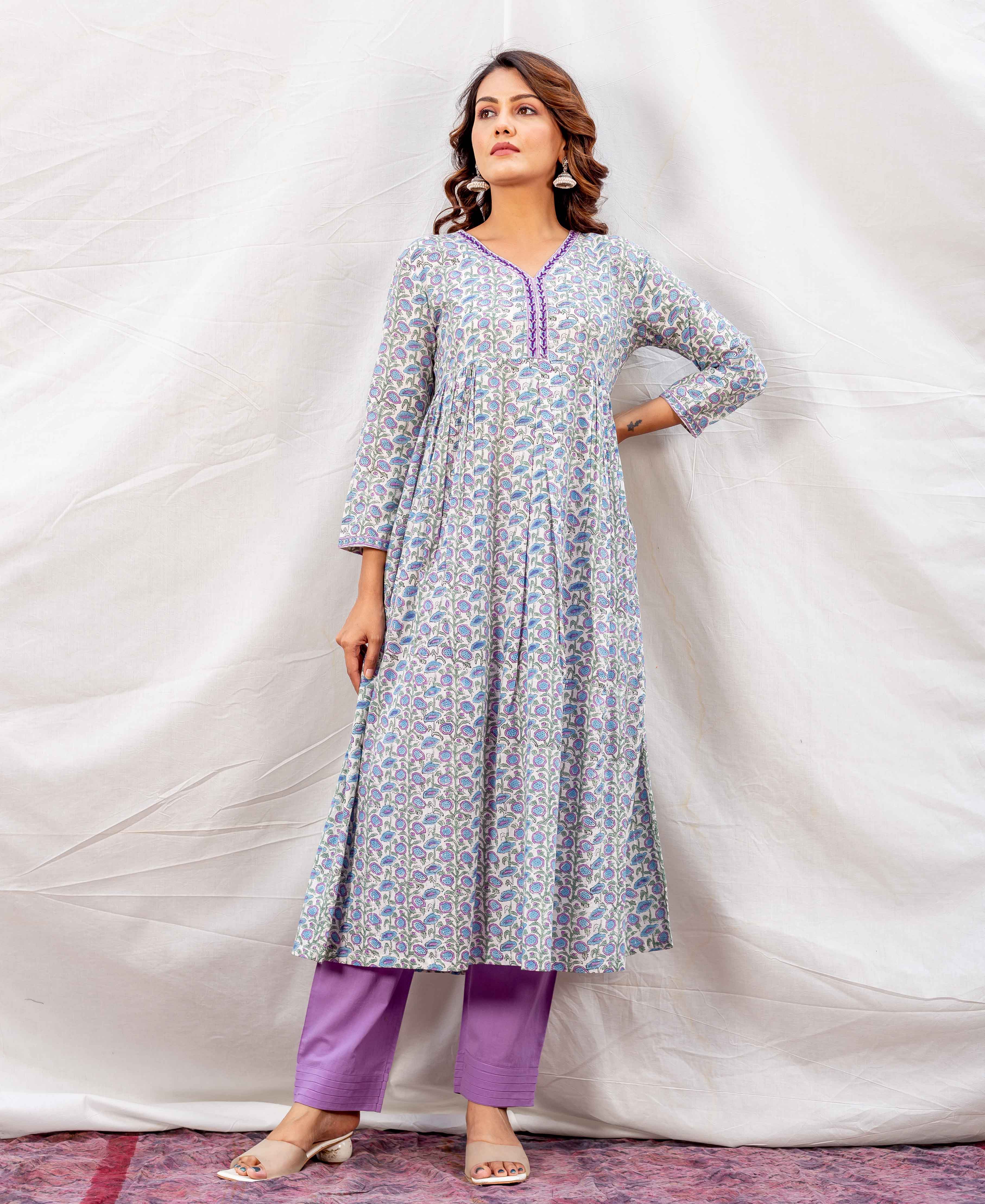 Light blue and purple floral hand-block printed A-line kurta, paired with purple pants on model.