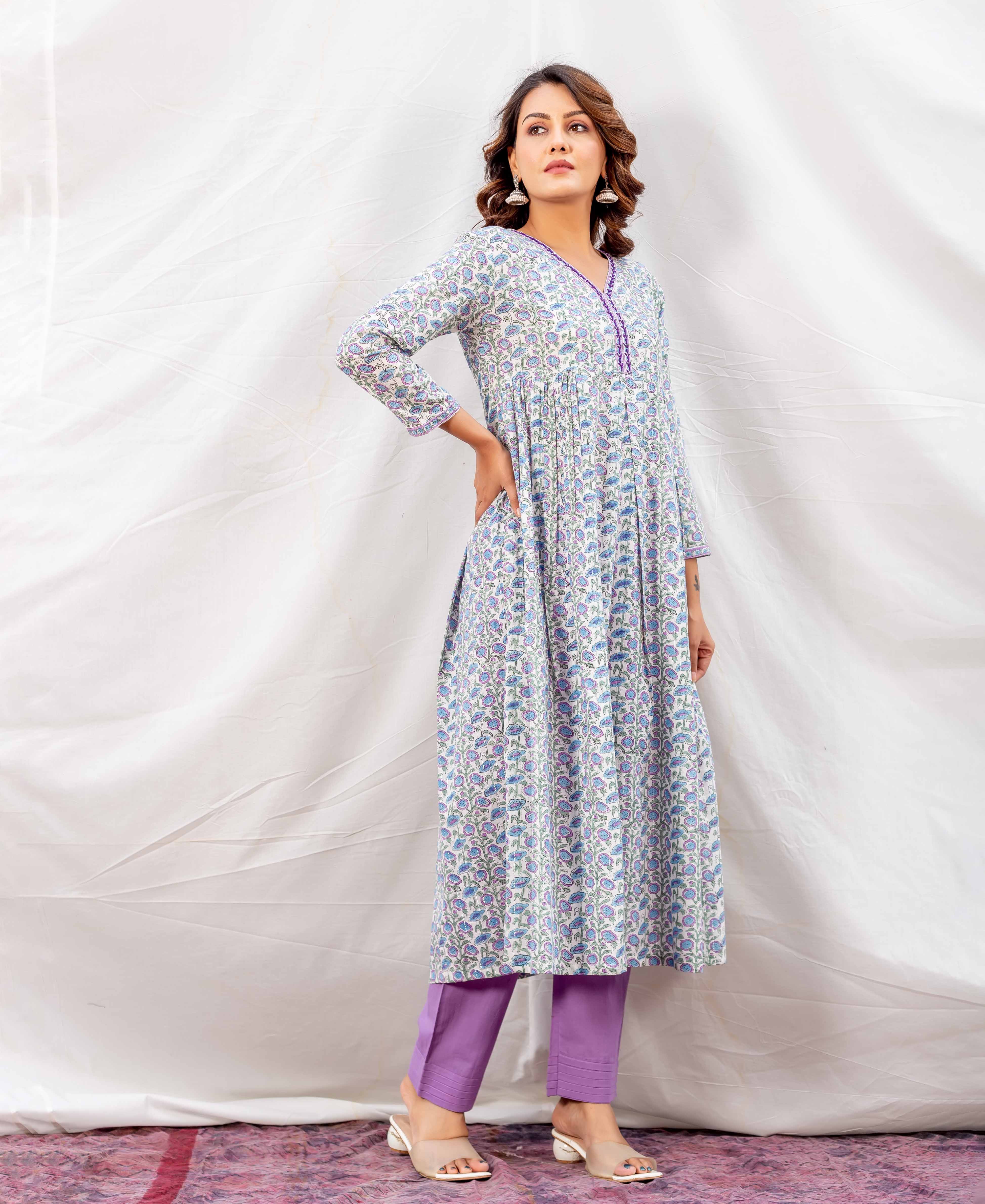 A-line kurta with blue, purple hand-block print and V-neck, worn by model with matching purple pants.