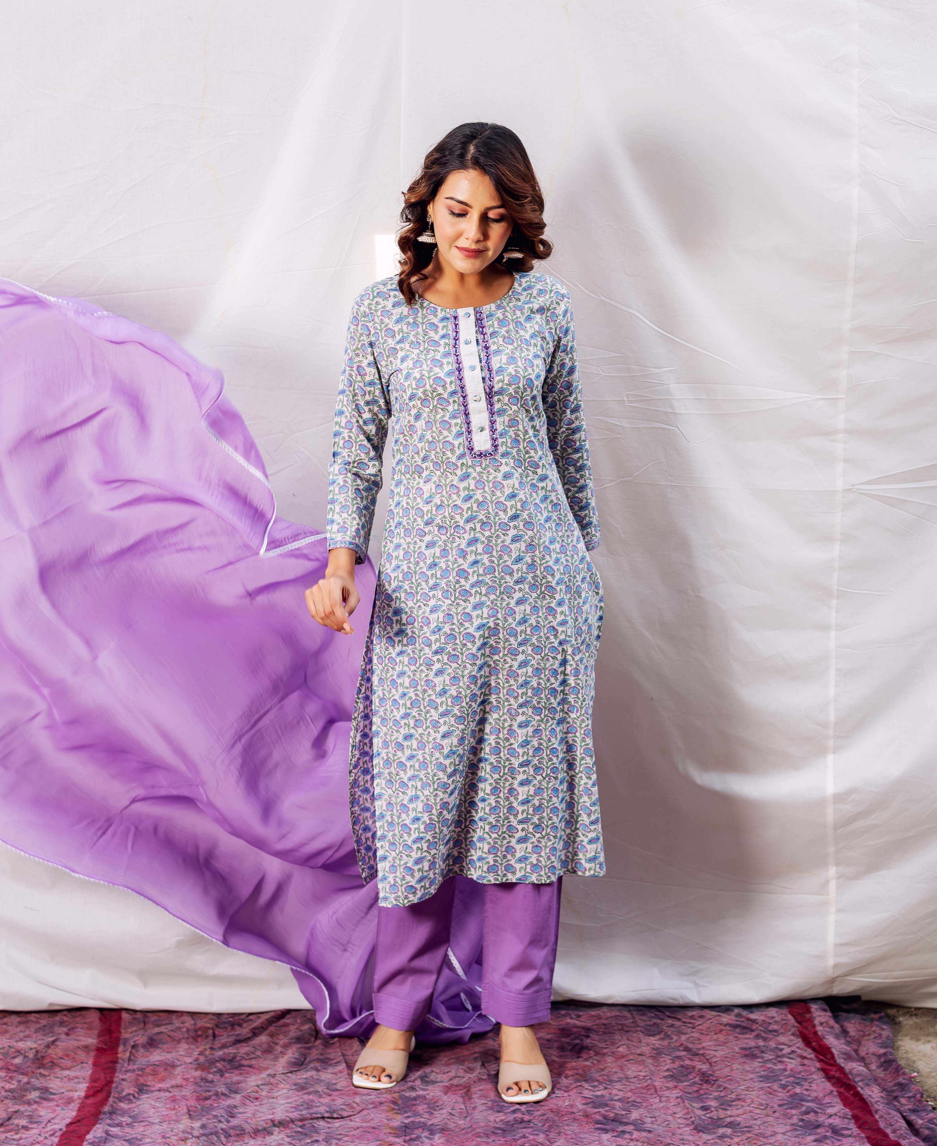 Hand-block-printed light blue straight kurta with blue and purple floral motifs on a model.