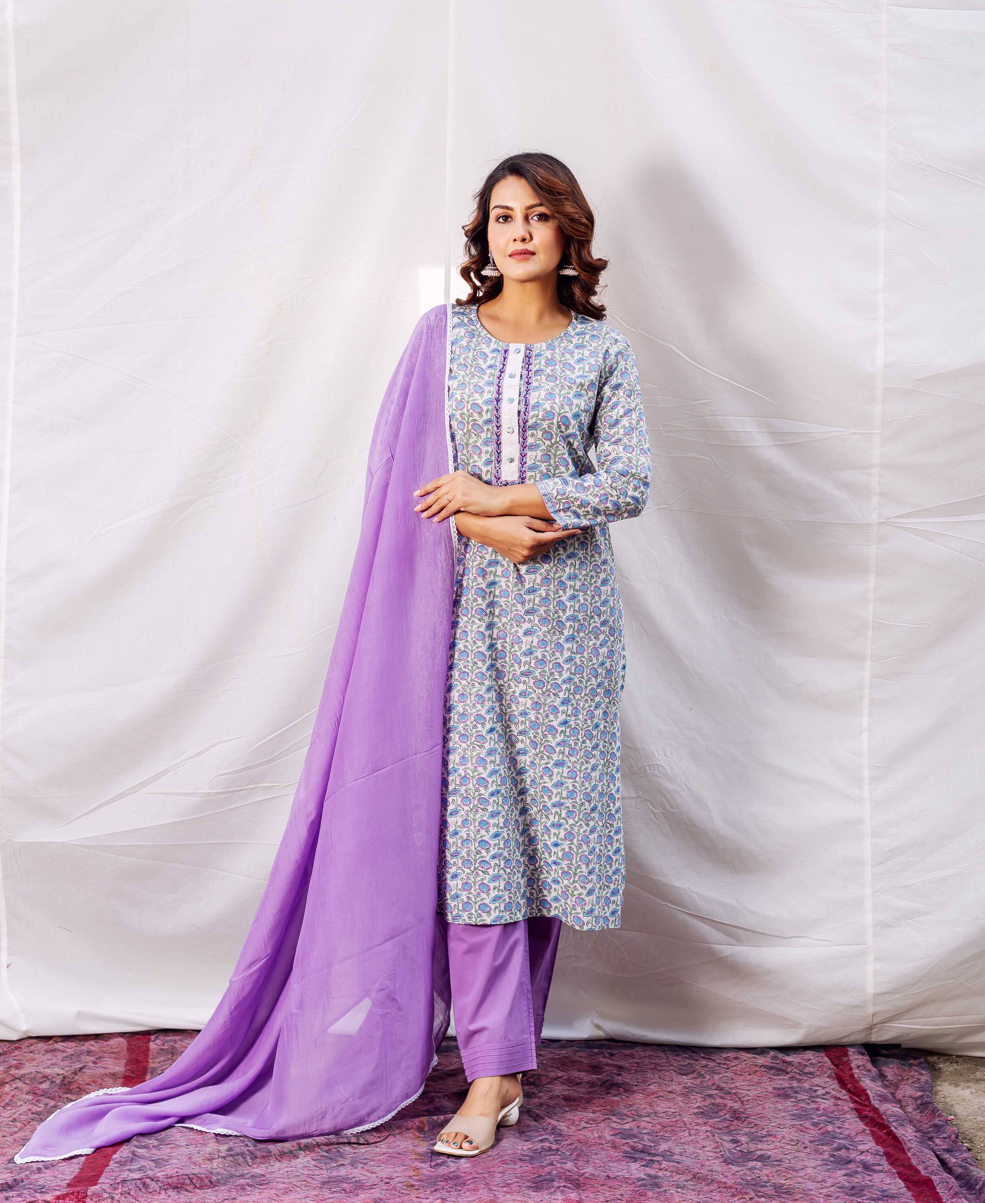 Model in full-length light blue floral block print kurta, lavender pants and matching dupatta.