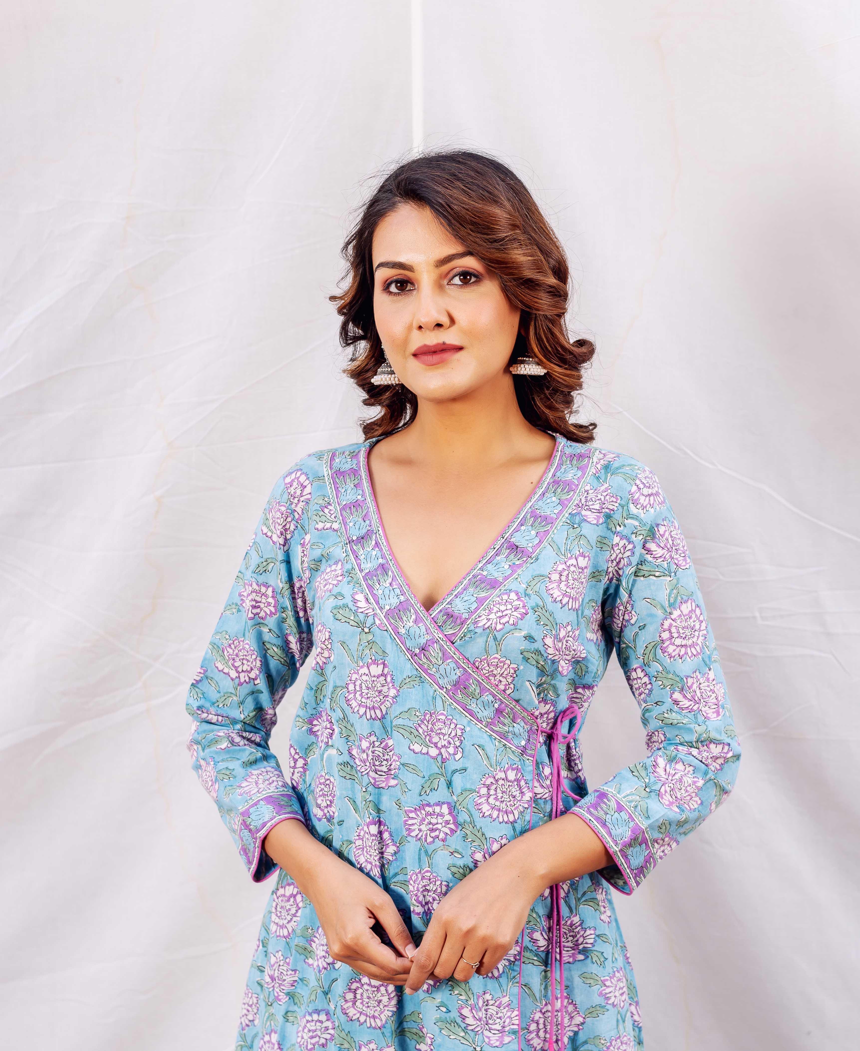 A woman wearing a blue floral print angrakha kurta.