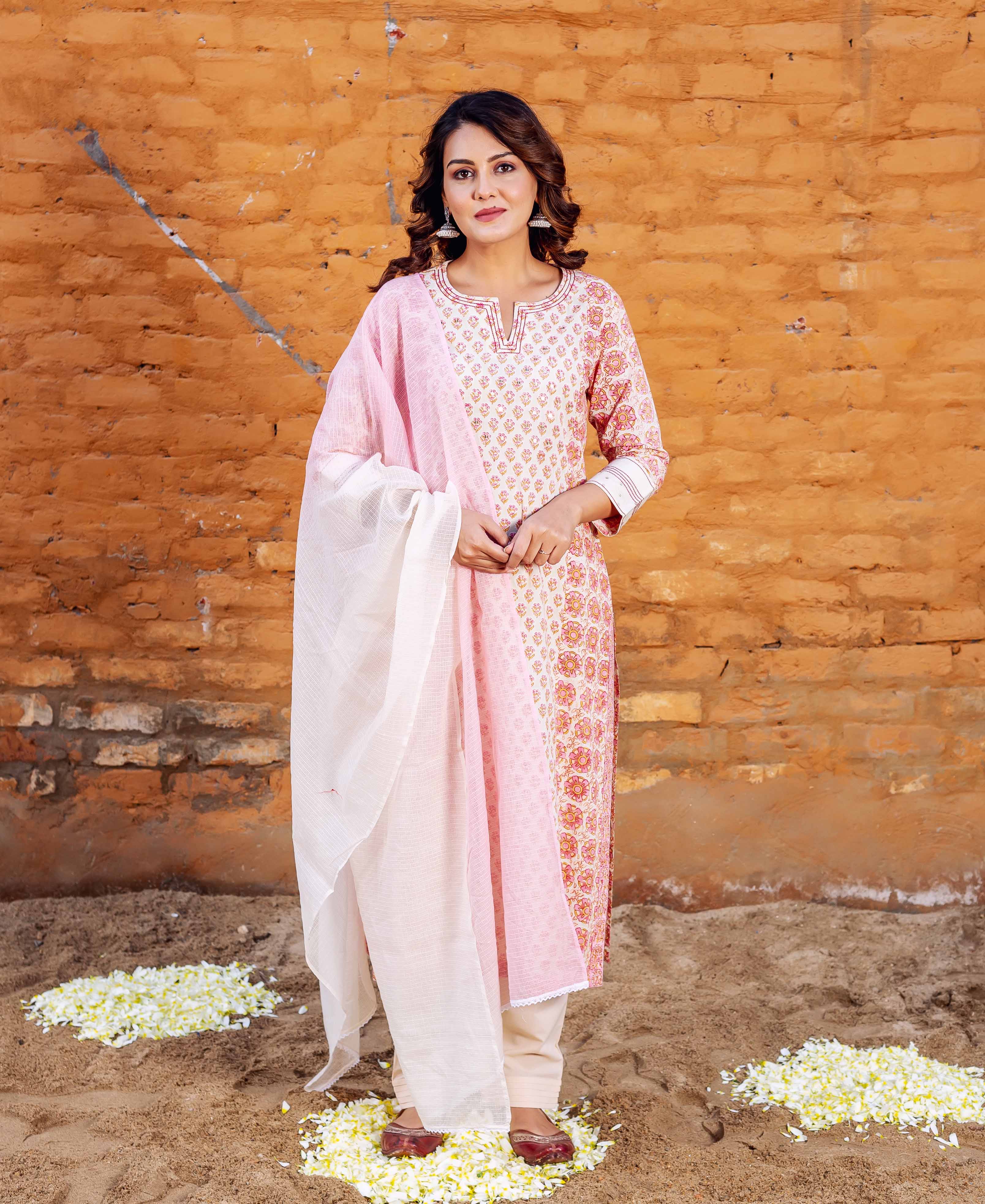 Full-length shot of a model wearing a pink and white block-printed straight kurta set.
