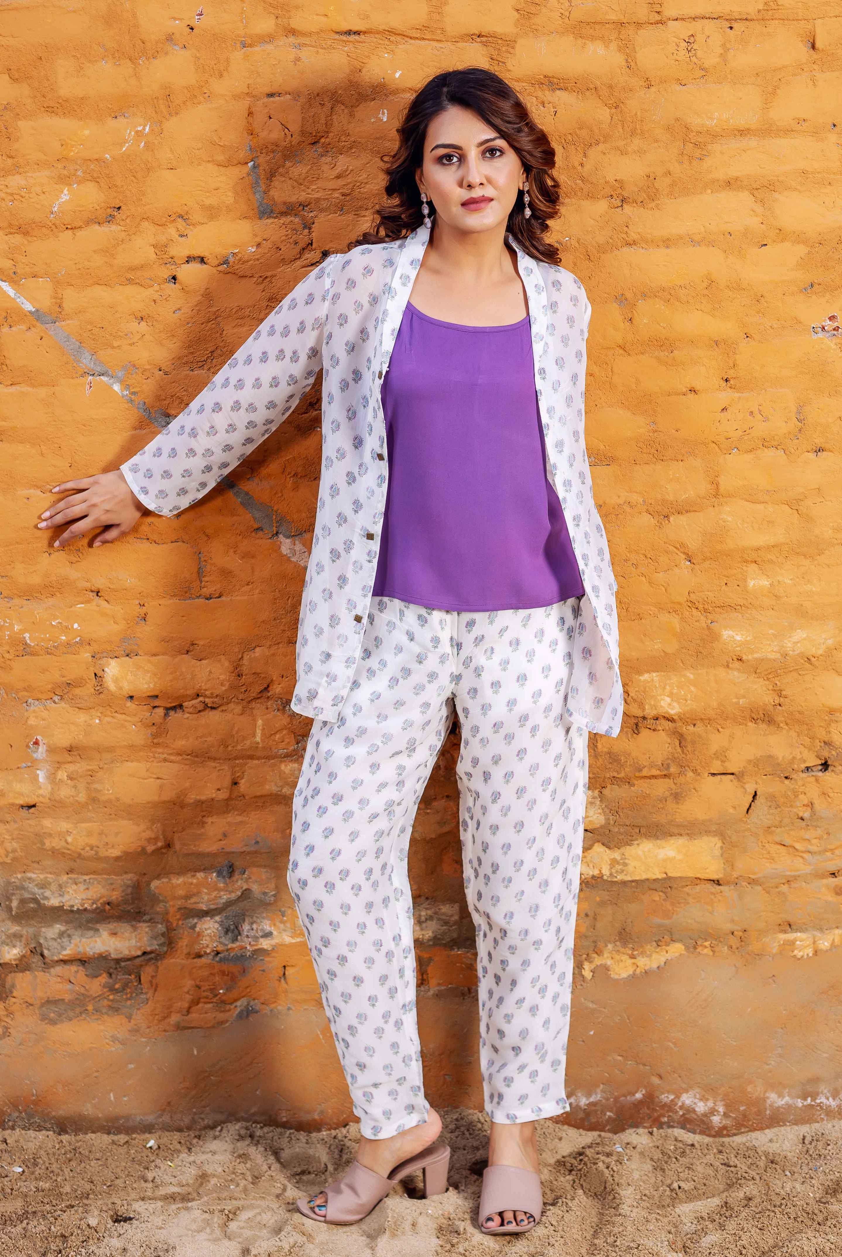 Model in white hand-block printed co-ord set with purple tank top, full look.