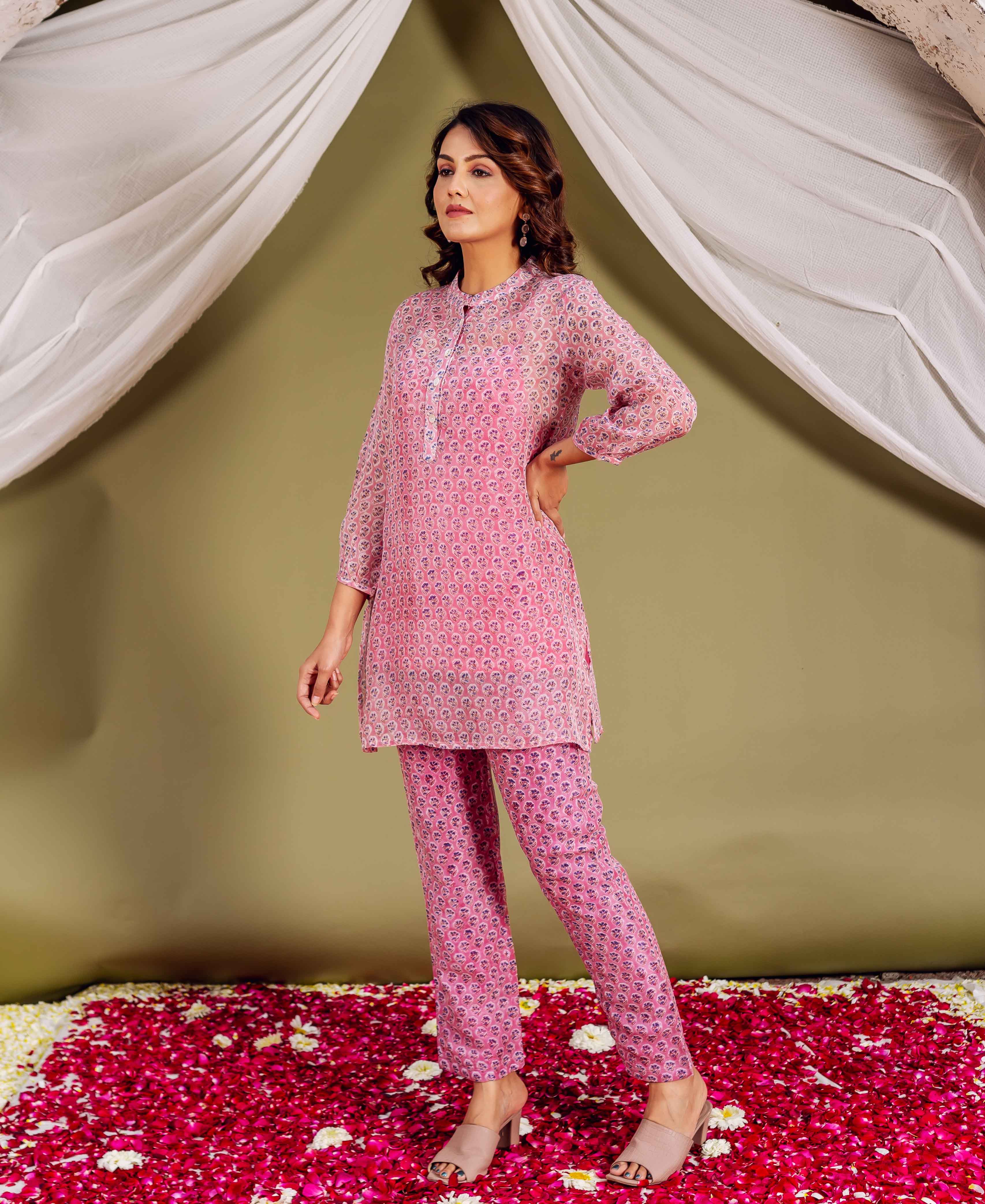 Model wears a pink hand-block-printed Maaya Co-ord Set, an ethnic tunic and pants.