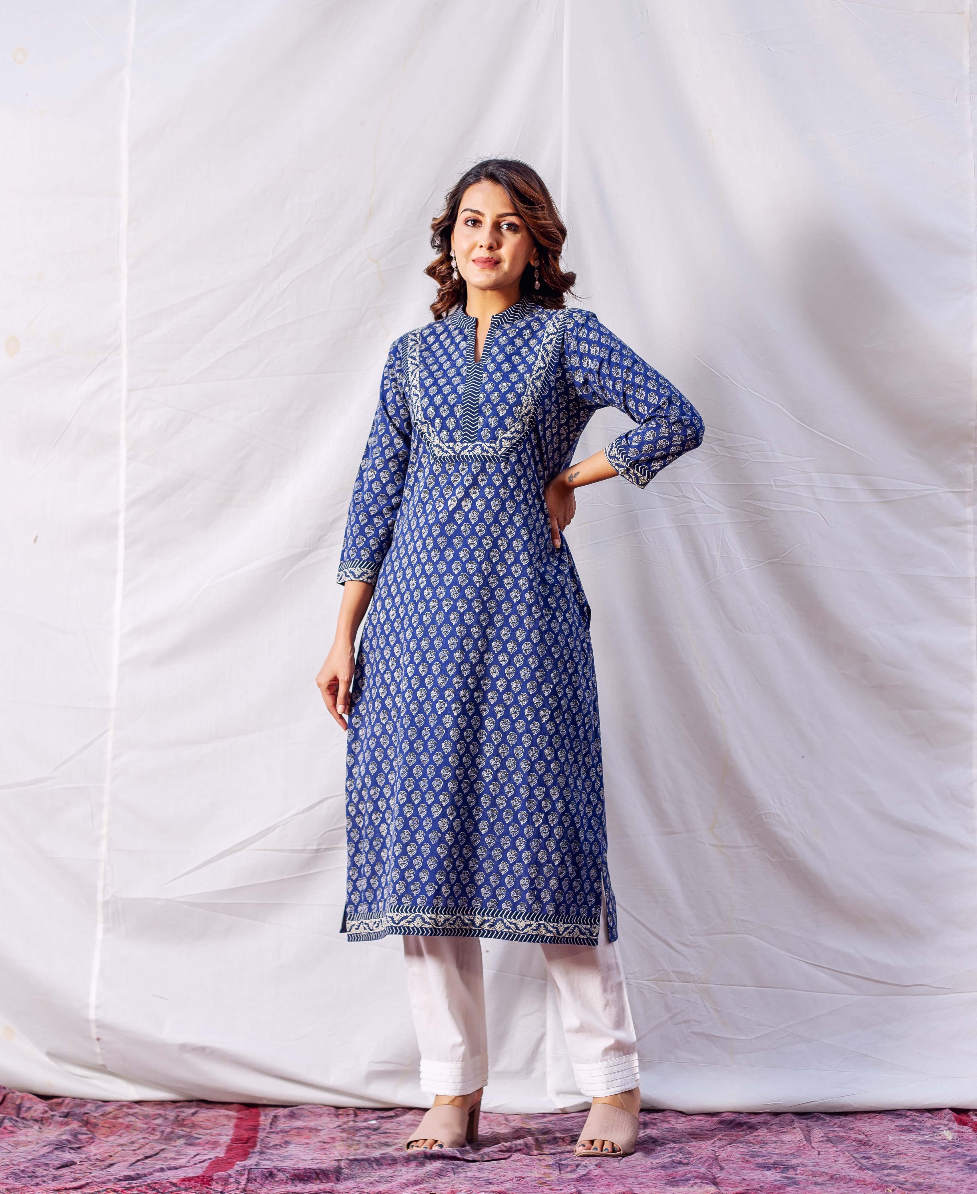 Front view model wearing indigo hand block printed straight kurta with white patterns and embroidered yoke.