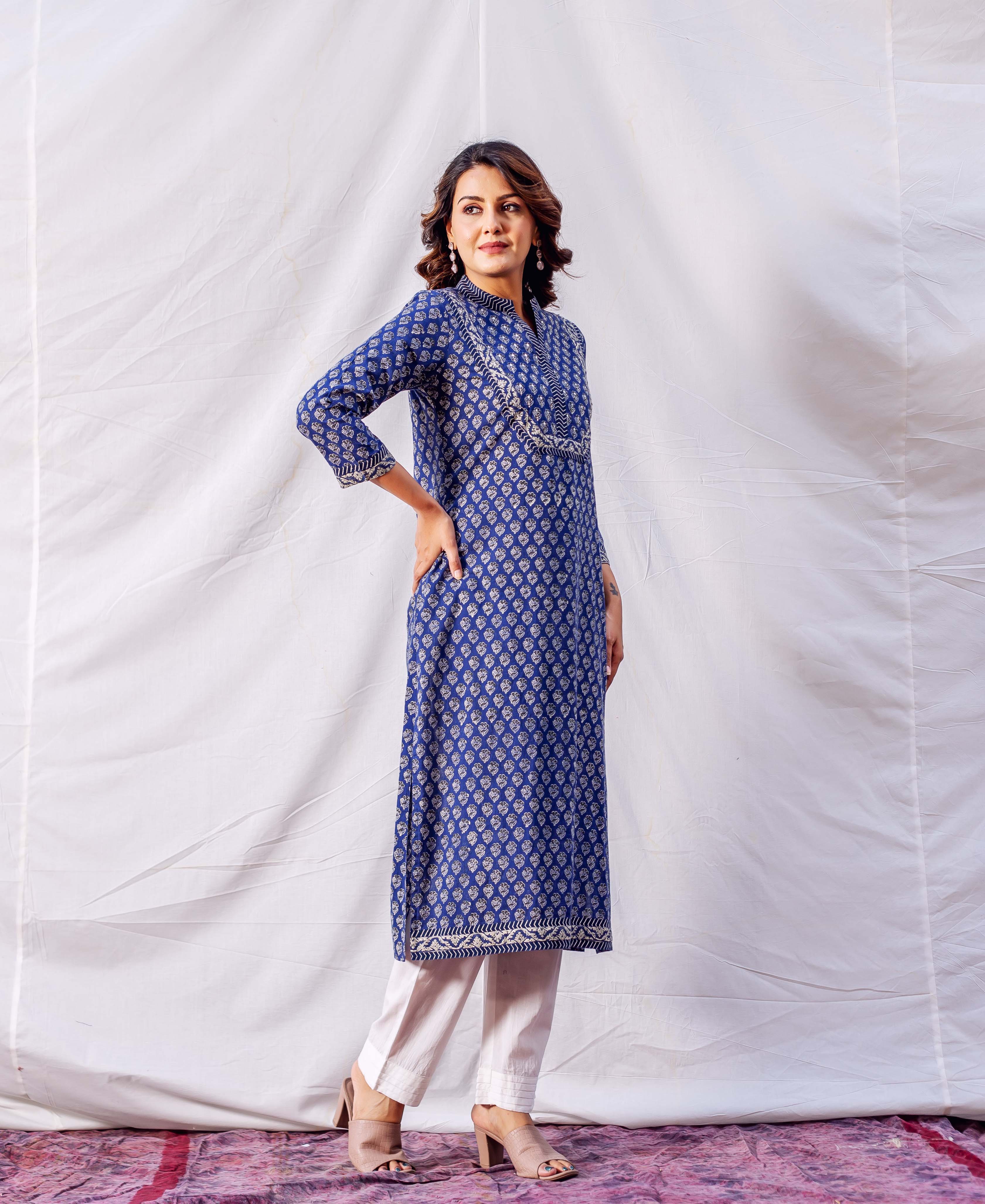 Model wearing indigo hand block printed and embroidered straight kurta with white pants.