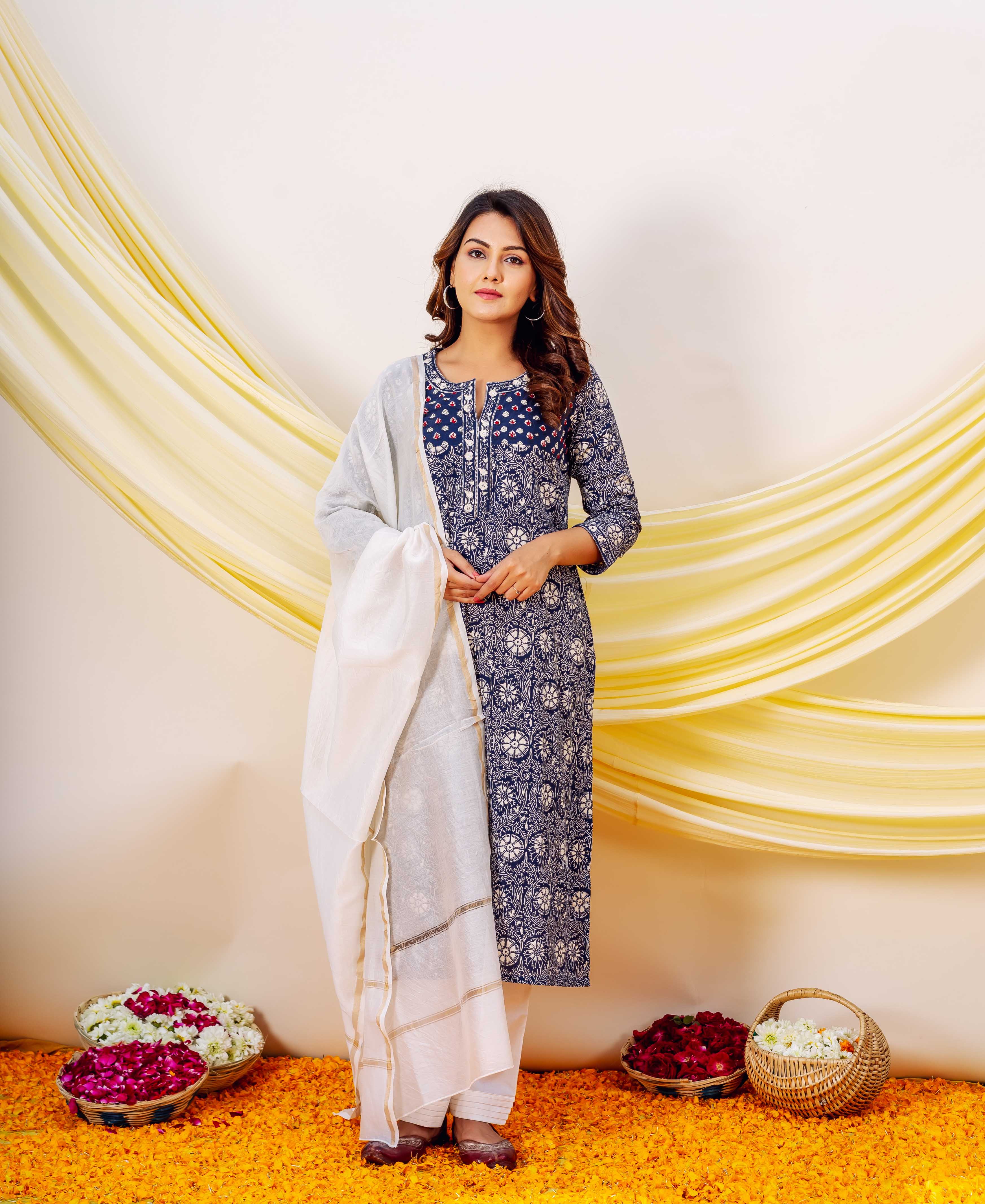 Front view of model in indigo hand-block print embroidered straight kurta with white dupatta.