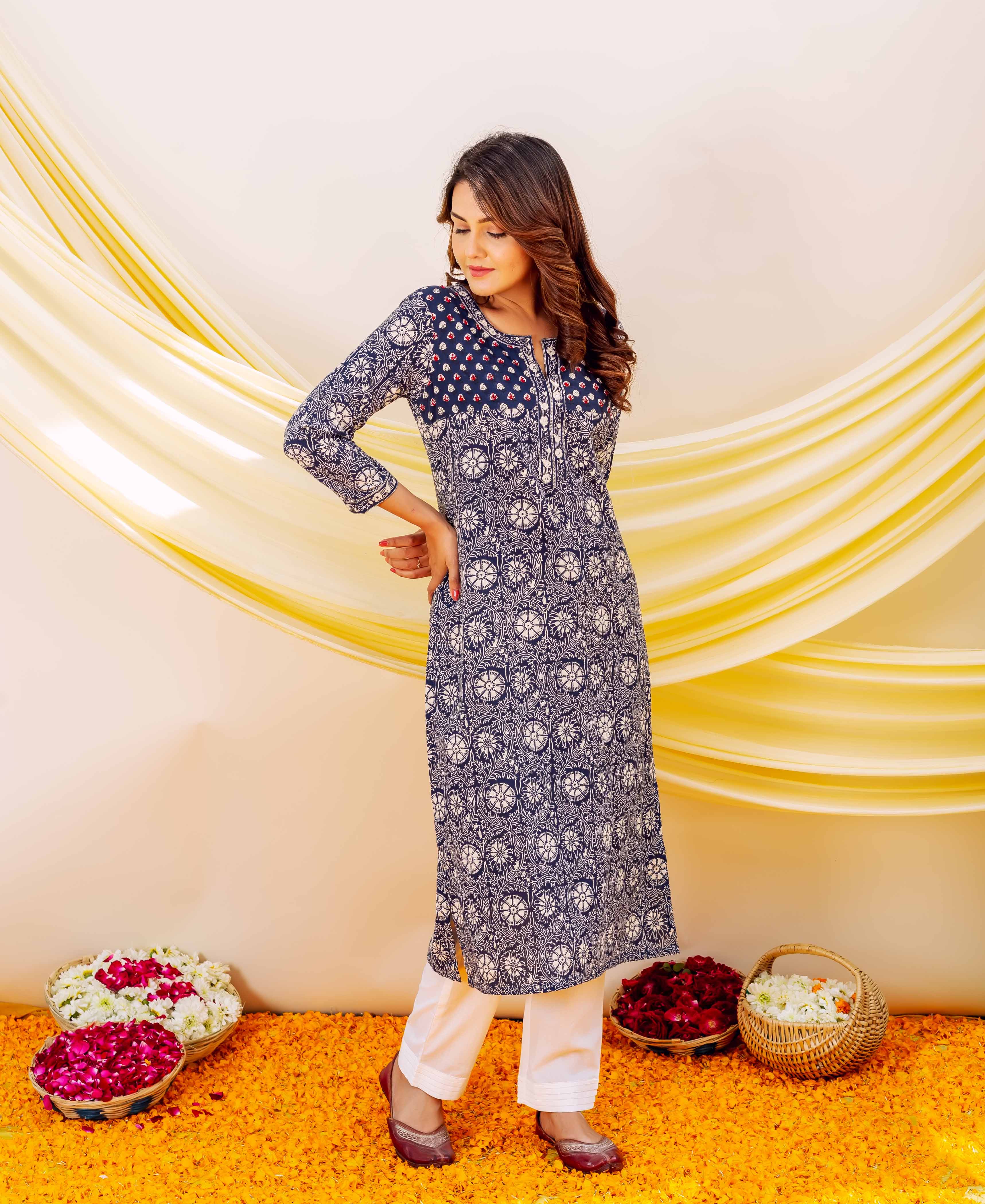 Full front view of model in an indigo hand-block-printed kurta with embroidered yoke.
