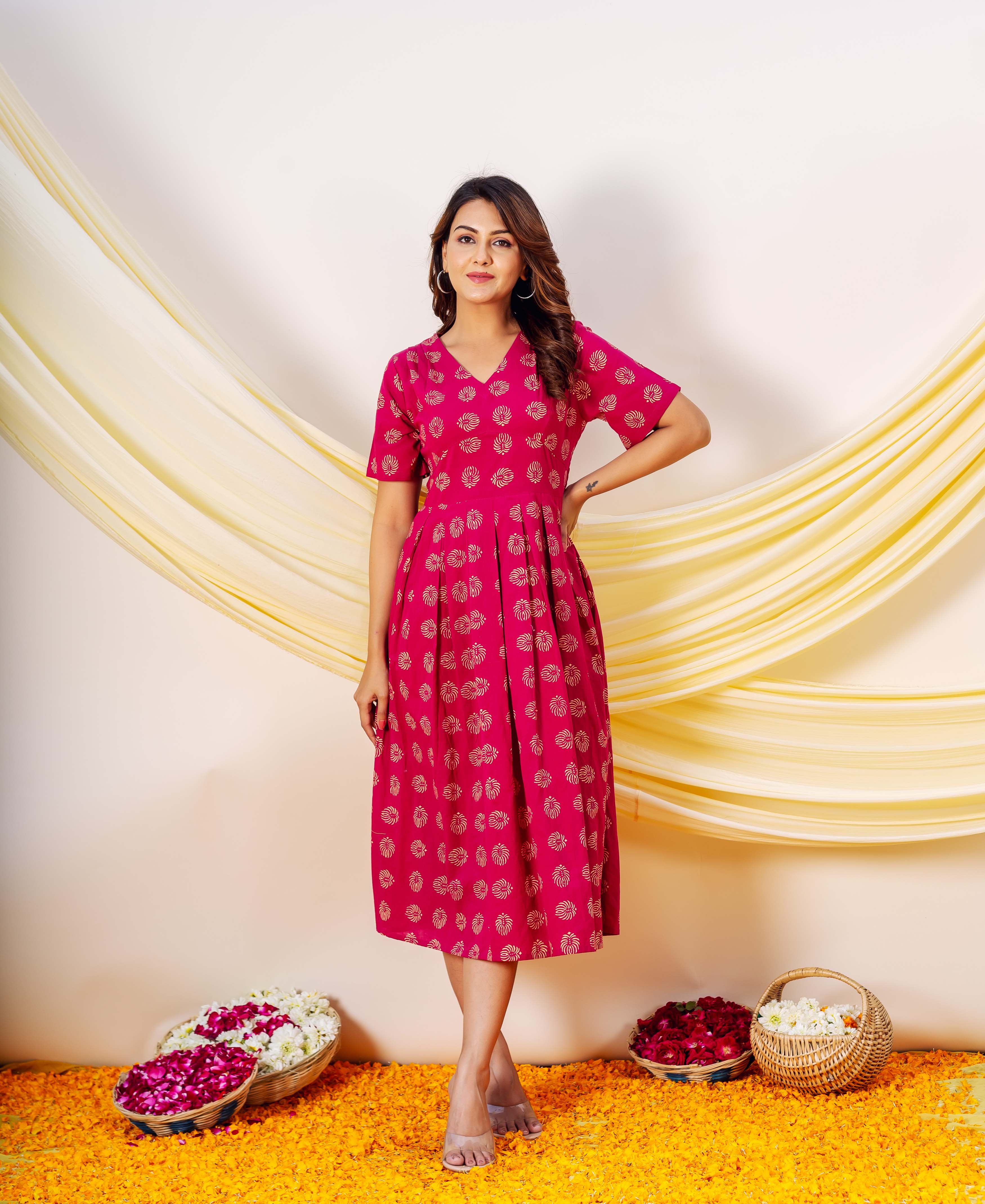 Full-look front view of model in magenta hand-block-printed Eleanor Dress with gold patterns.