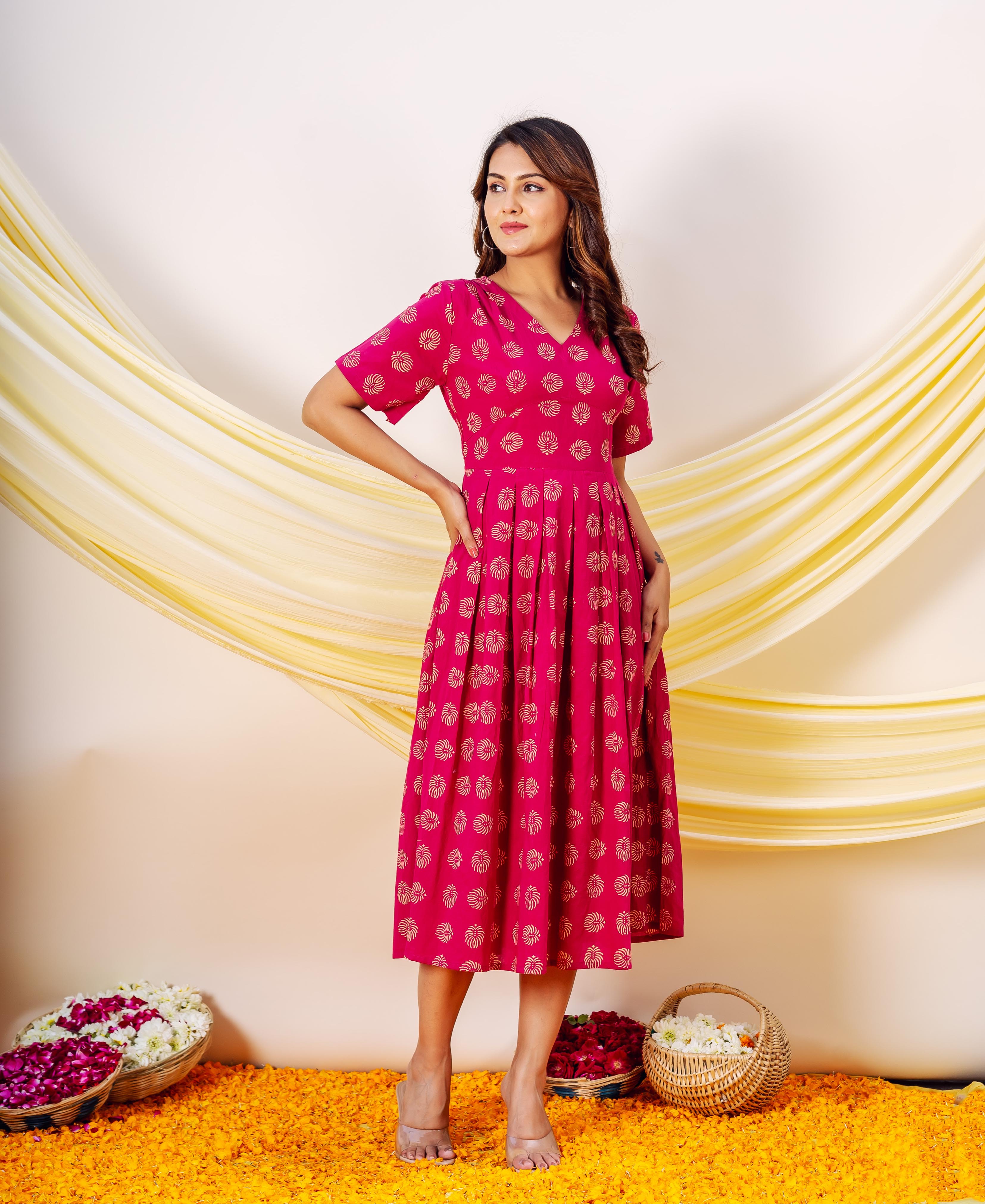 Model in full look of fuchsia MISSPRINT hand-block printed ethnic dress with gold print.