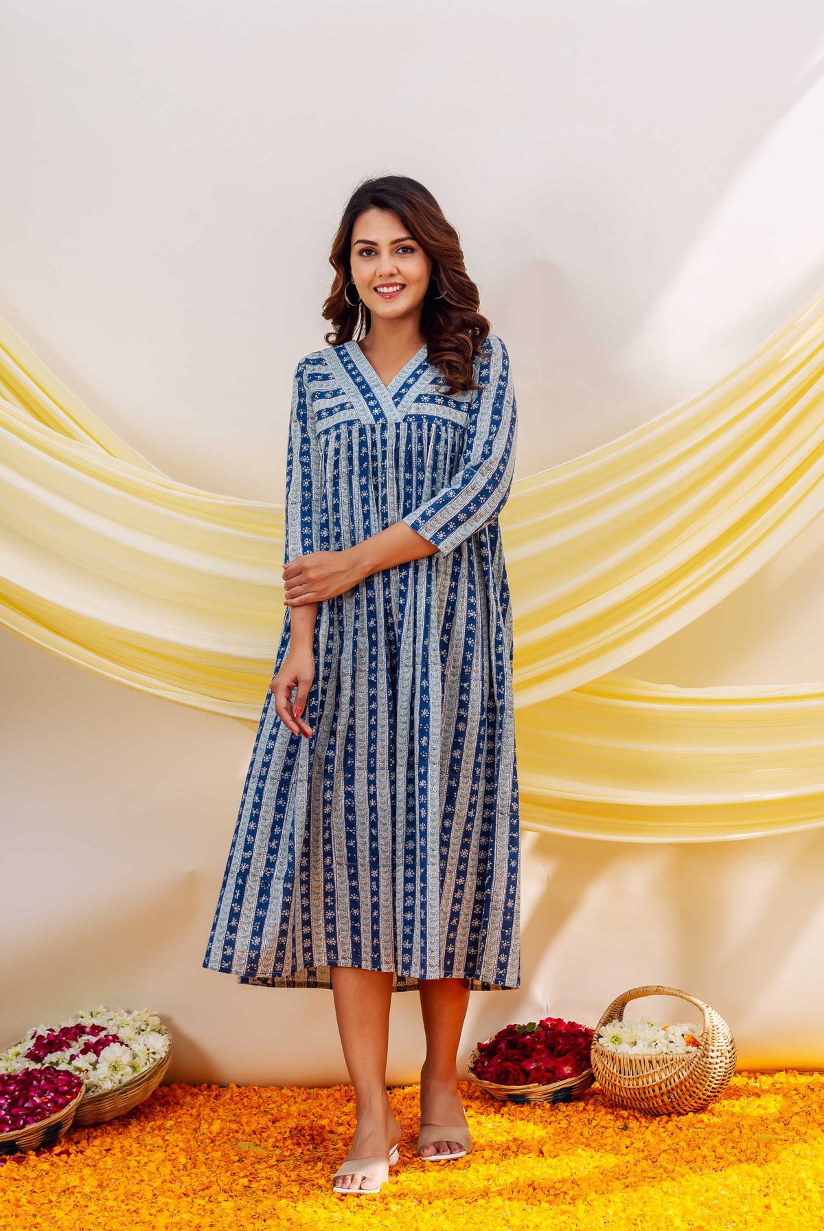 Front view of model wearing a full indigo and white hand-block printed ethnic dress.