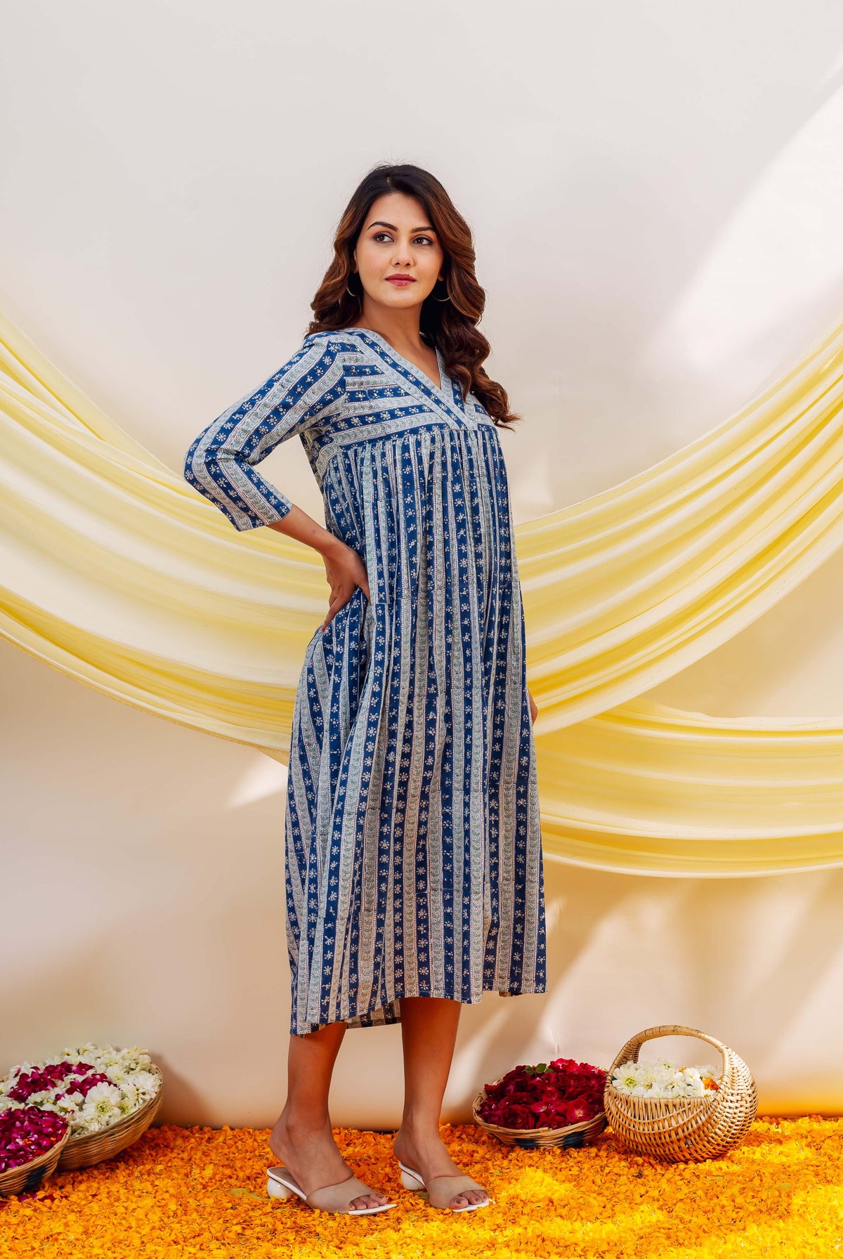Model in an indigo and white striped hand-block-printed ethnic midi dress.