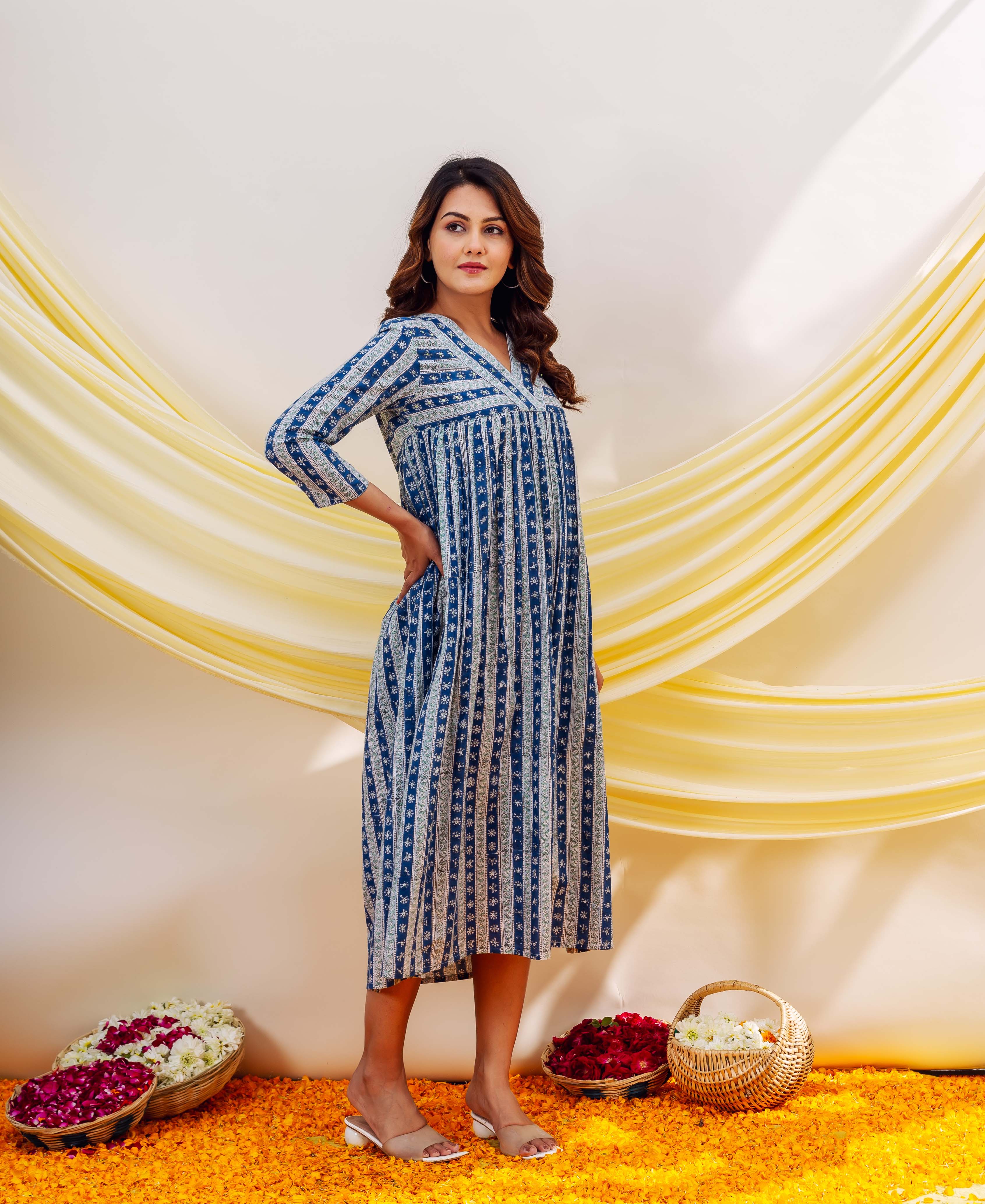 Model in an indigo and white striped hand-block-printed ethnic midi dress.