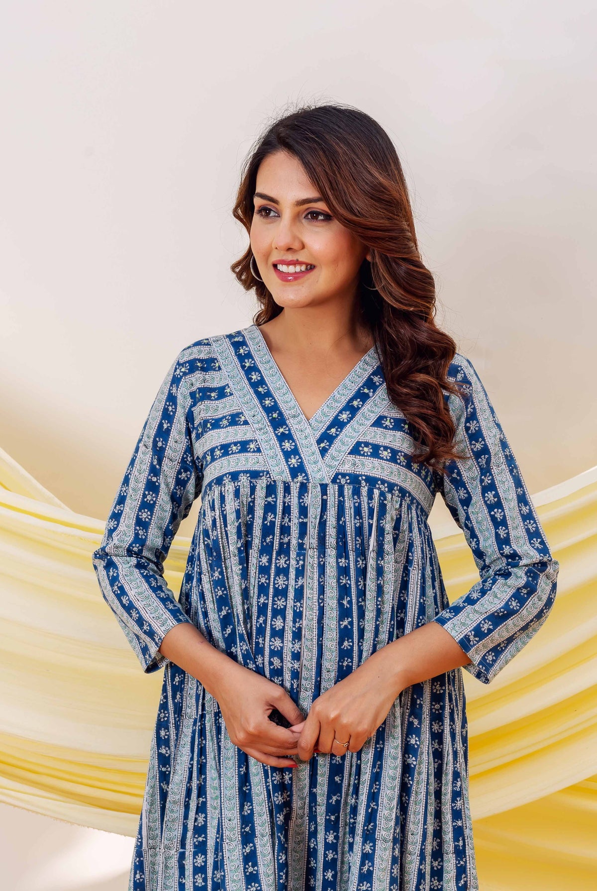 Front view of model in an indigo blue hand-block printed ethnic dress.
