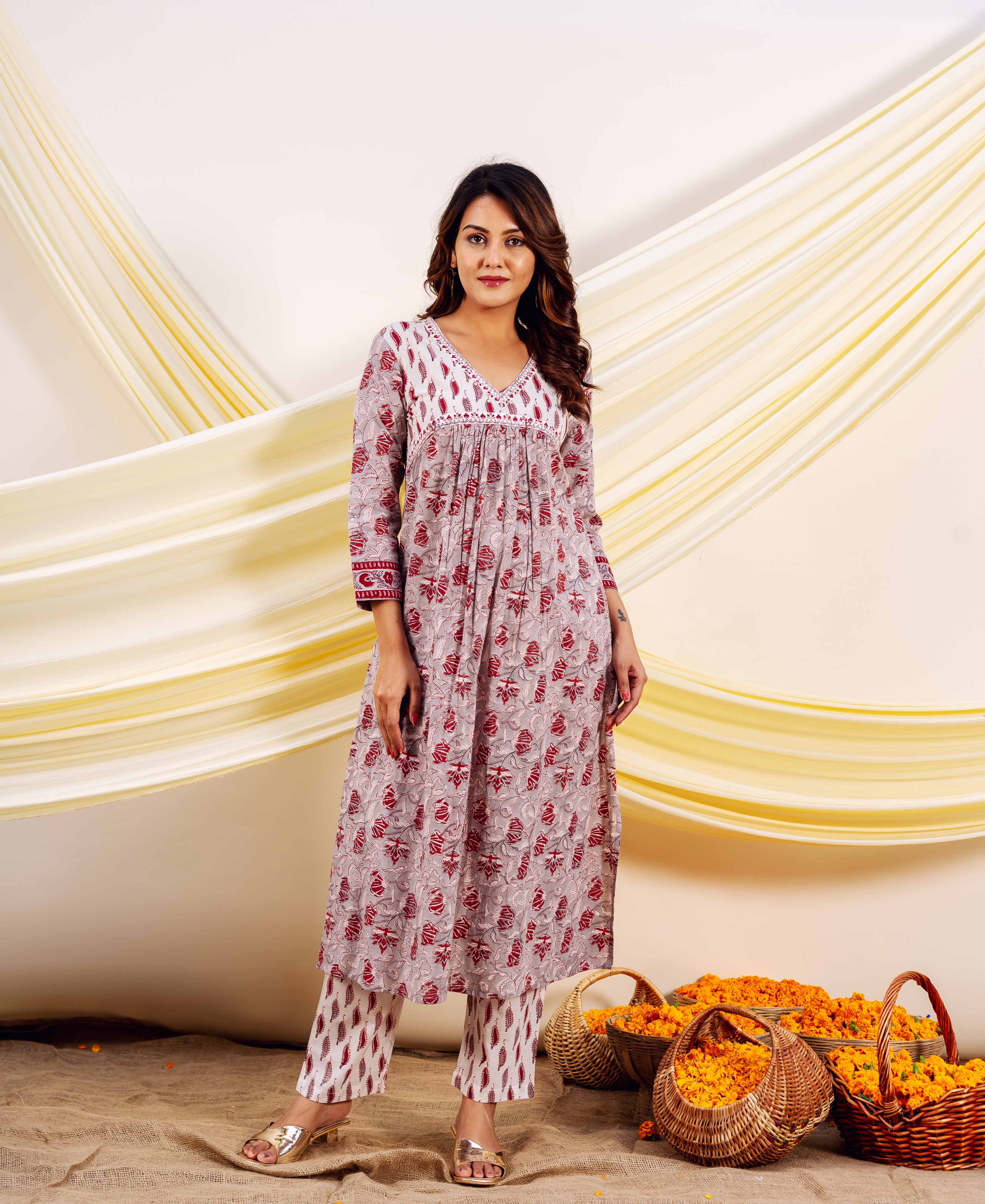 Full-length shot of a model wearing a grey and red hand-block printed Naira kurta set.