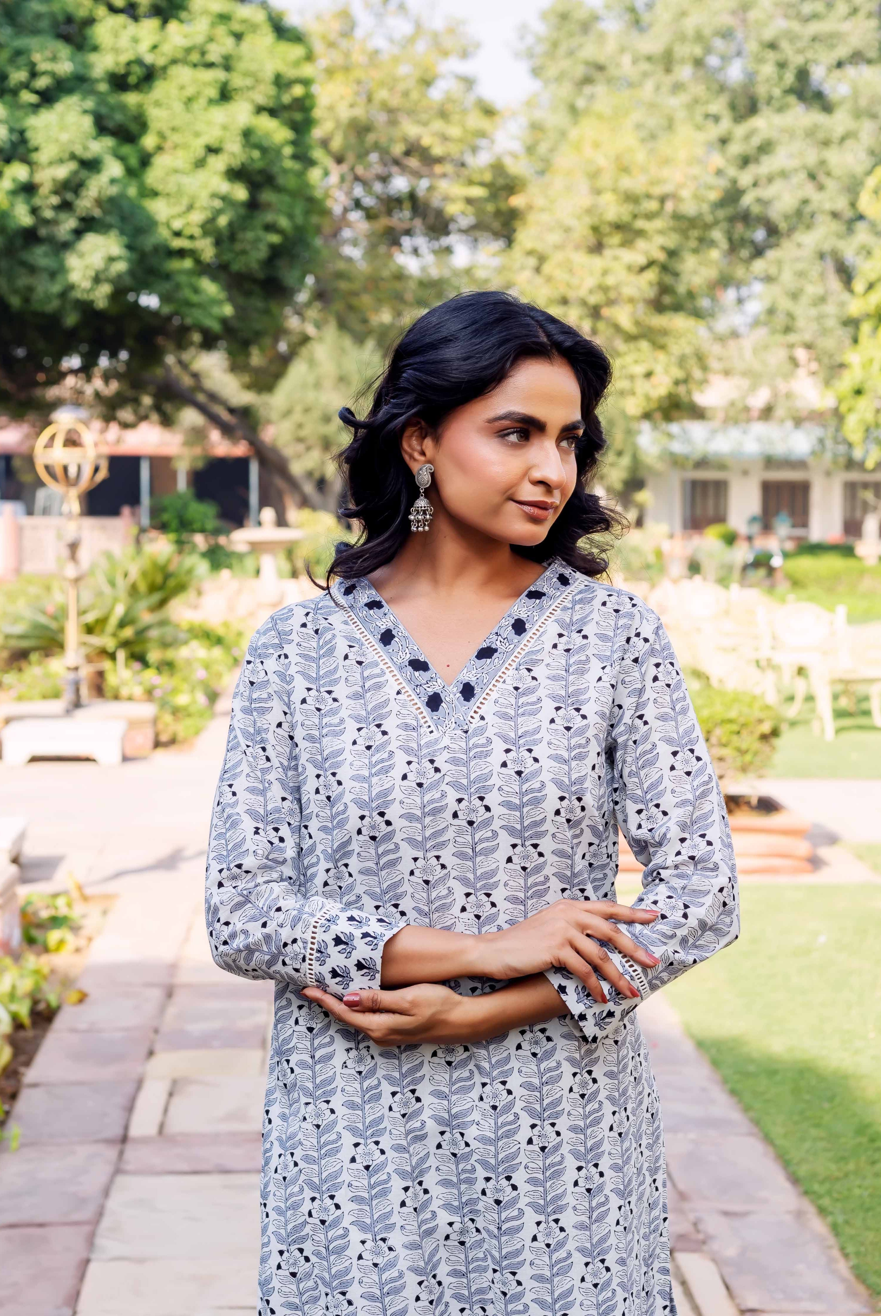 Model wears white and dark blue leaf-patterned Eshani Block Printed Cotton Kurta.