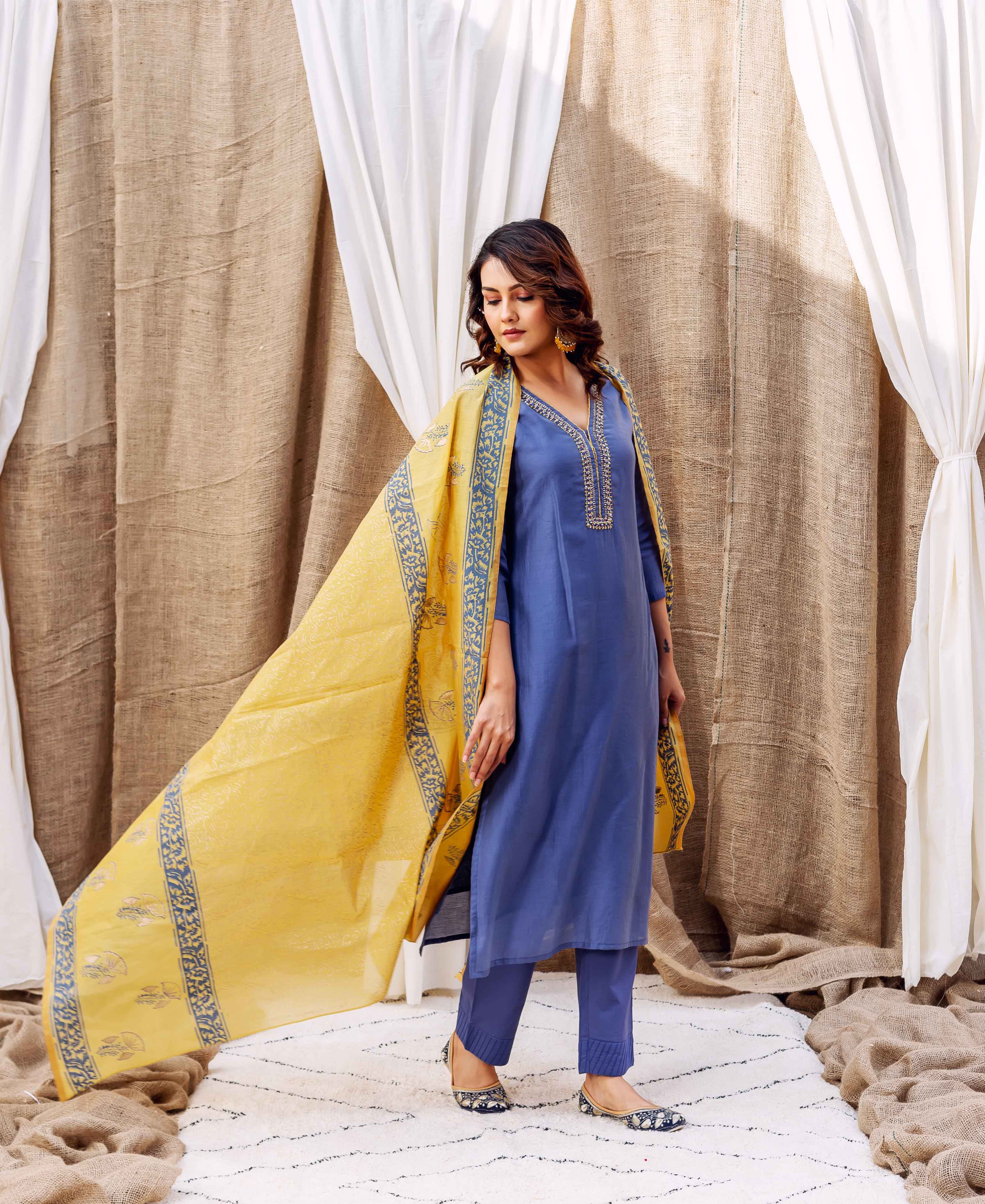 Steel blue chanderi kurta with gold detailing and yellow hand-block-printed dupatta.