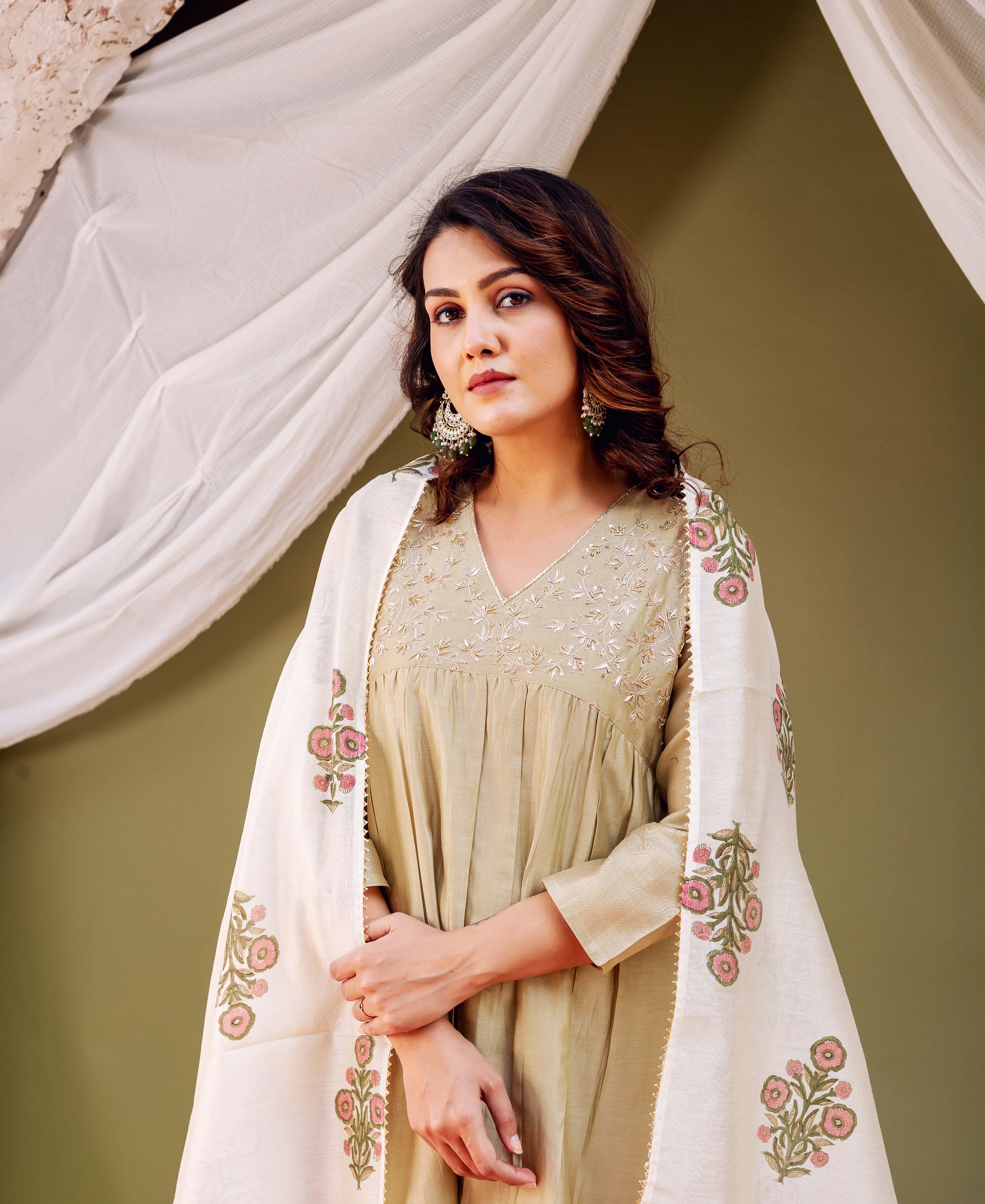 Front view model wearing beige silk chanderi dupatta with pink and green hand block printed floral patterns.