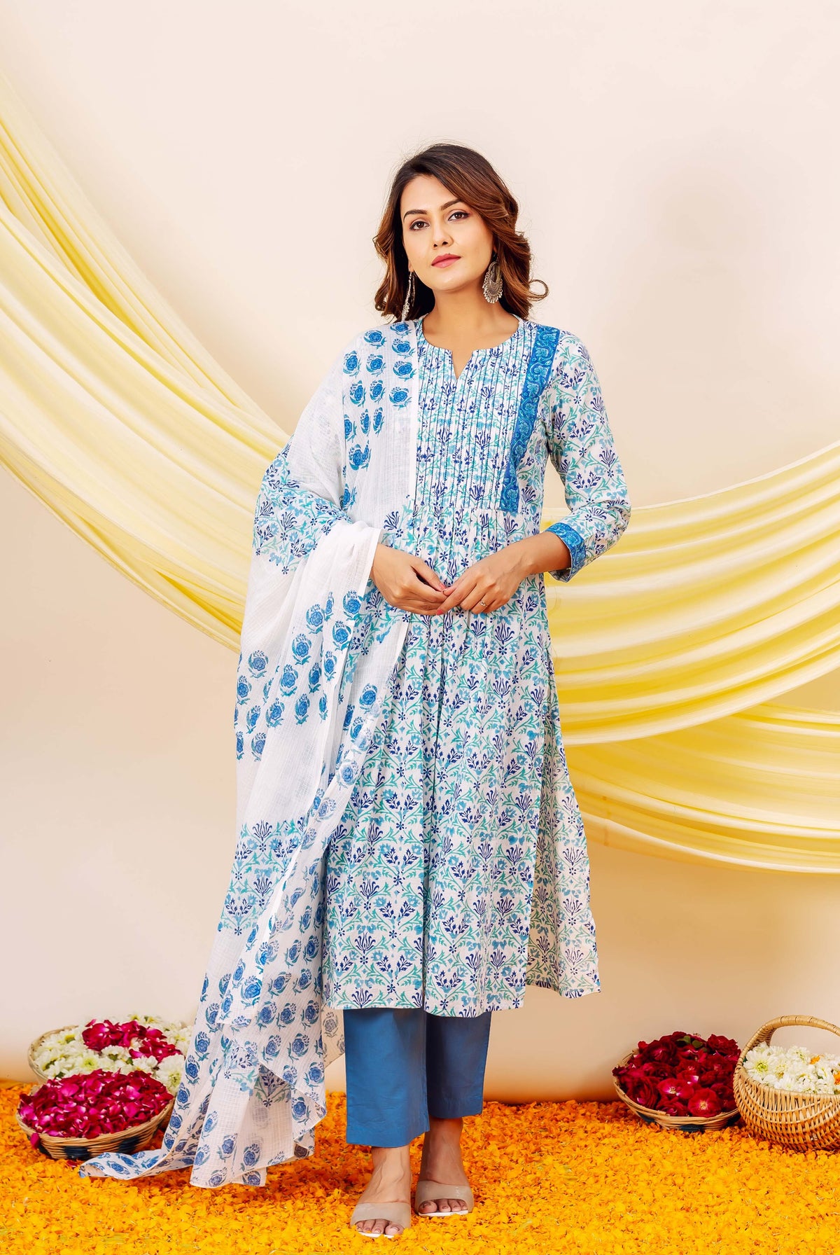 Front-facing model in a blue and white hand-block printed floral kurta set.