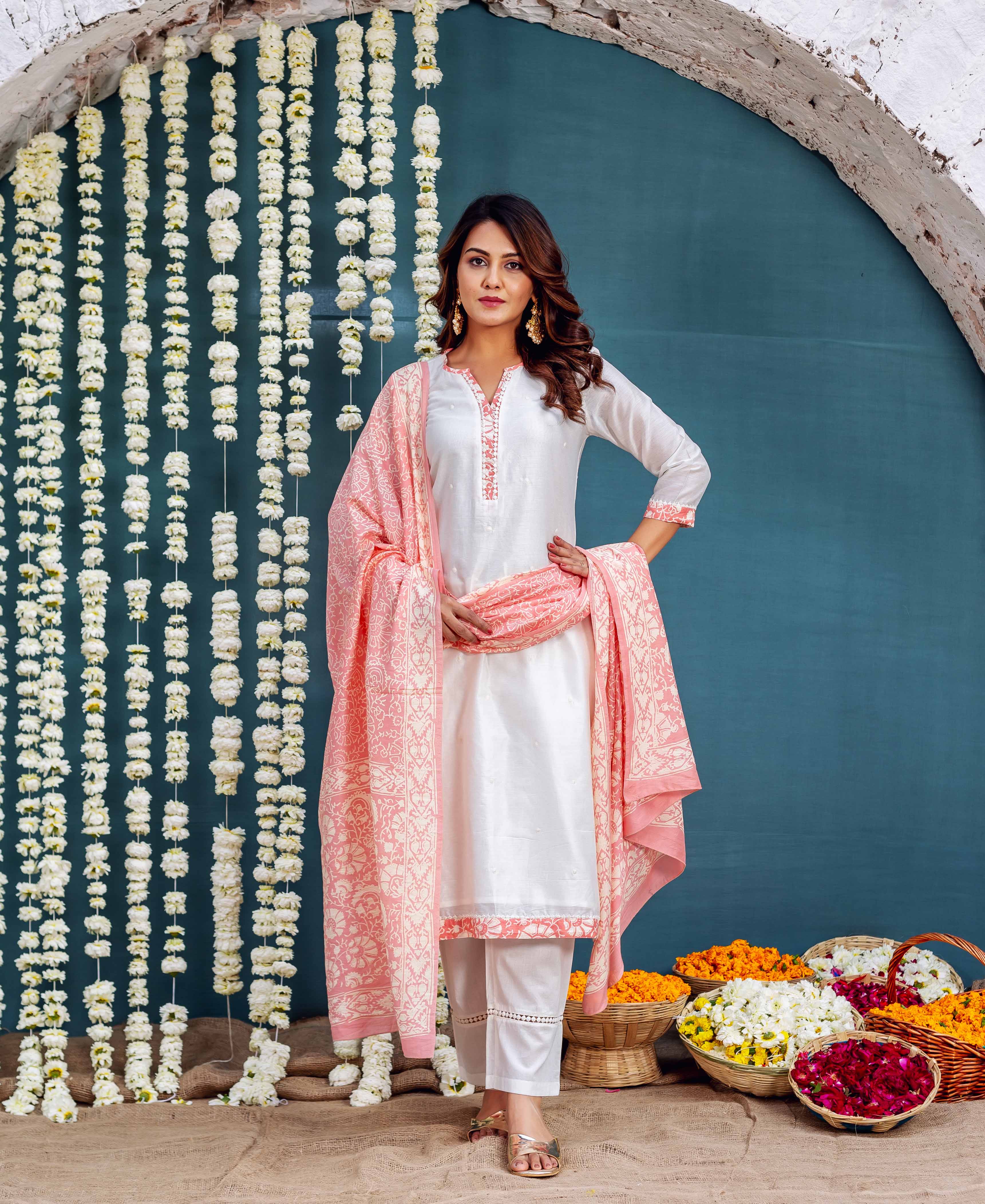 Full-body model in white Chanderi kurta set with pink hand-block-printed dupatta and trims.