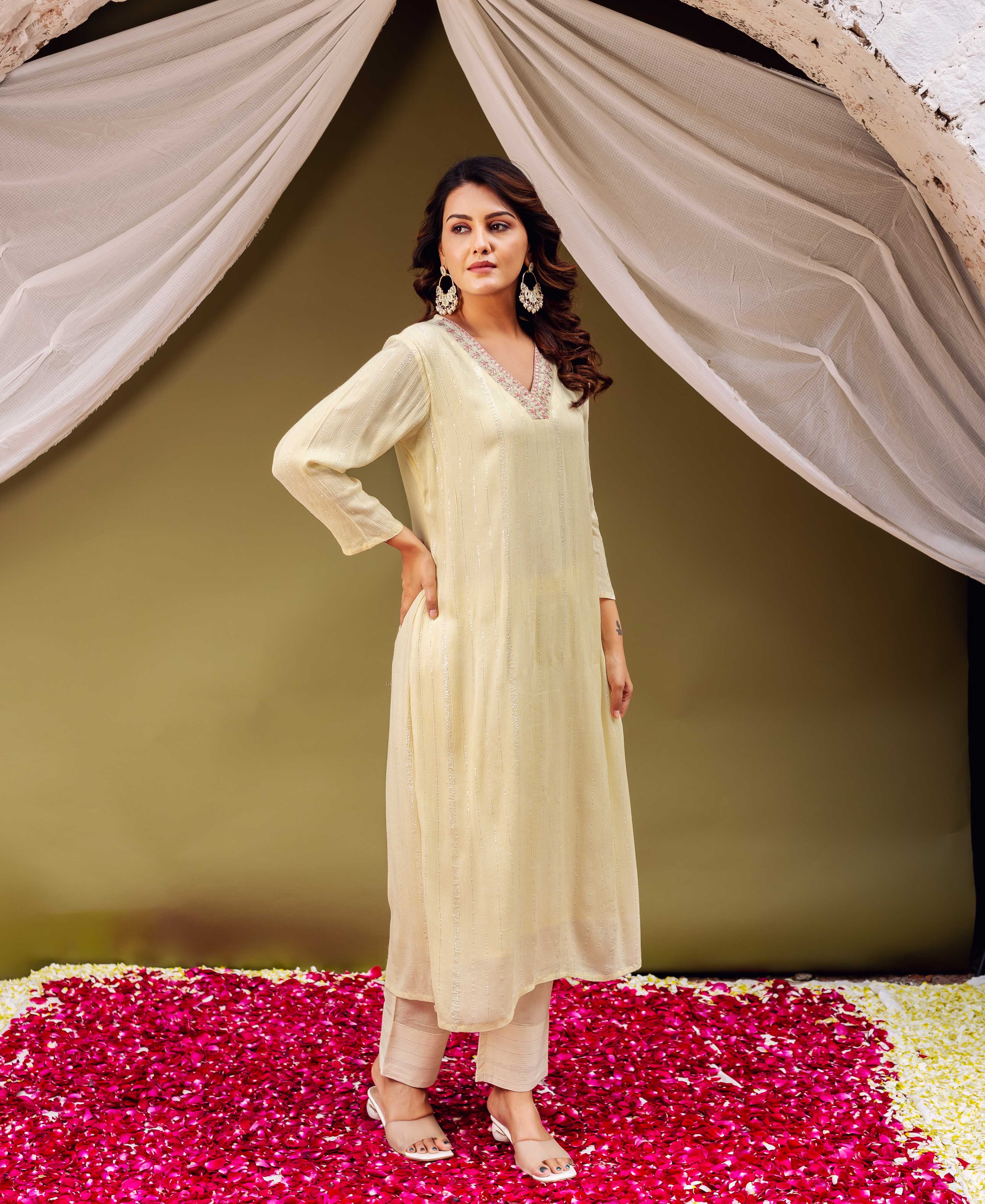 Lemon yellow embroidered V-neck kurta with subtle vertical stripes, worn by a model.
