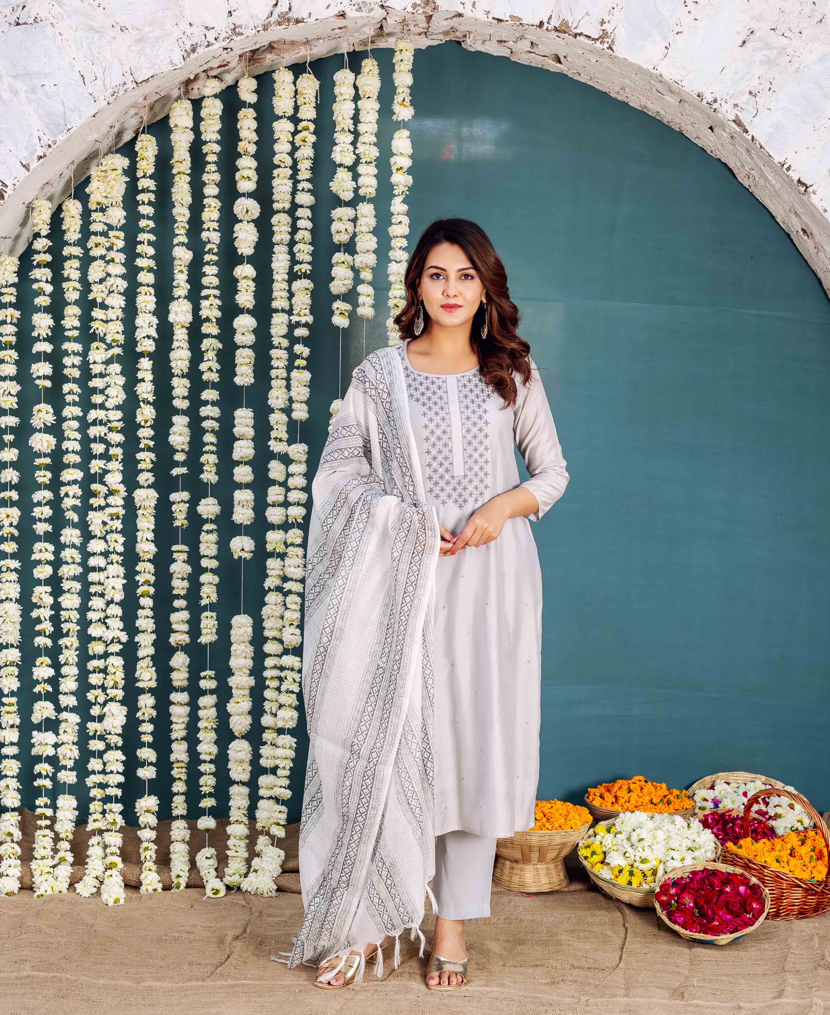 Full-length model in Zara Grey embroidered kurta with matching pants and hand-block-printed dupatta.