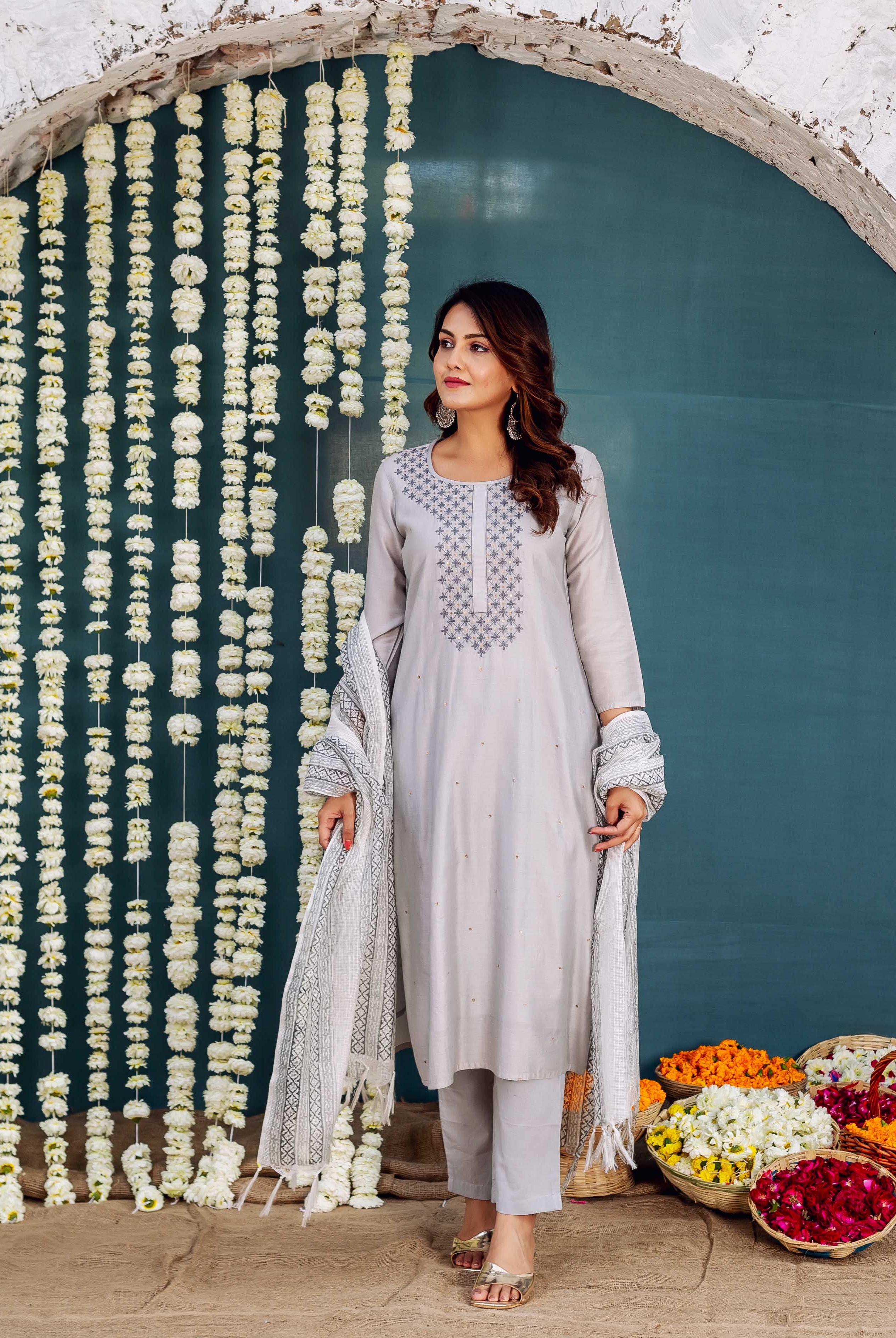 Full-length model in light grey embroidered kurta set with geometric block-printed dupatta.