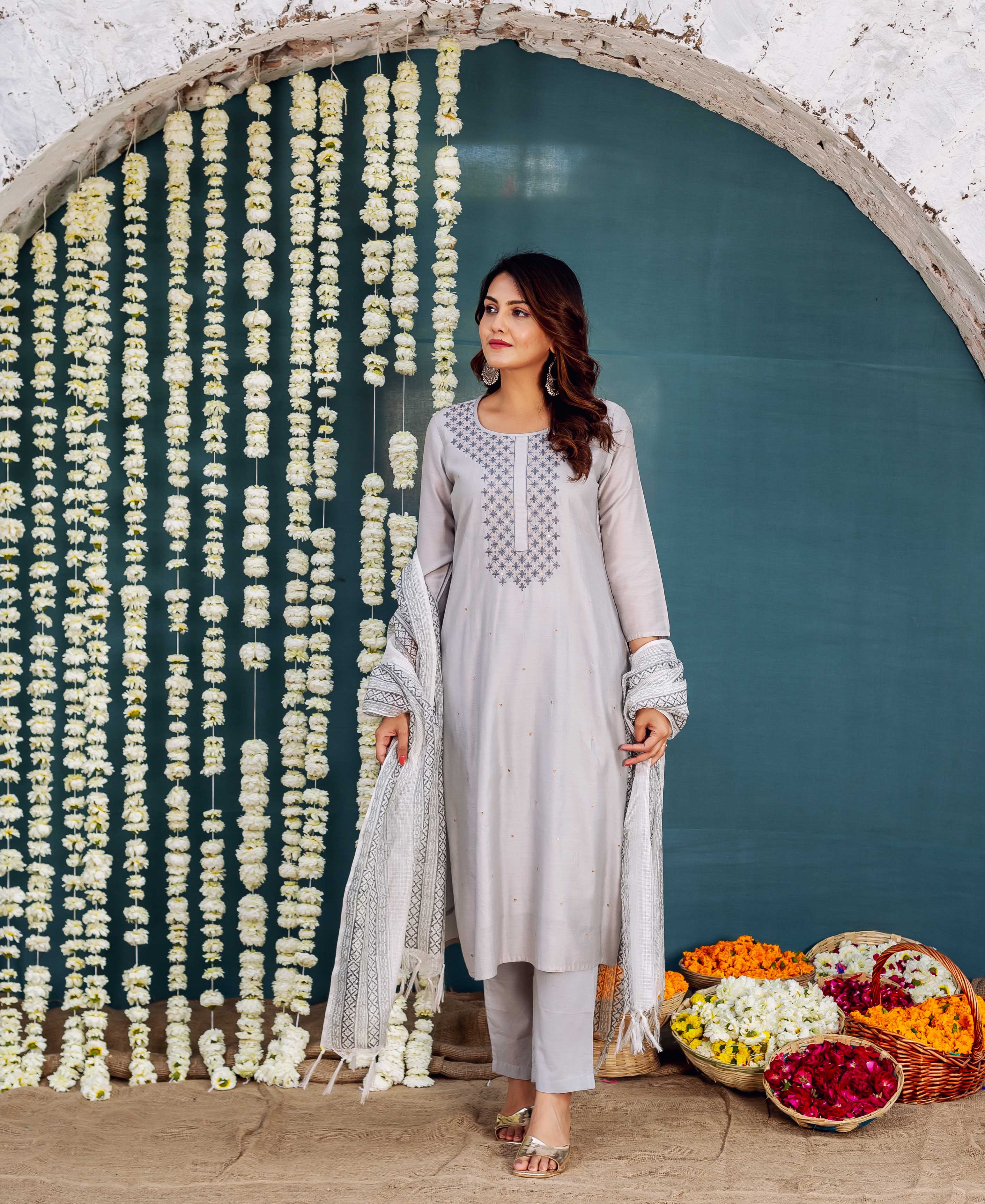 Full-length model in light grey embroidered kurta set with geometric block-printed dupatta.