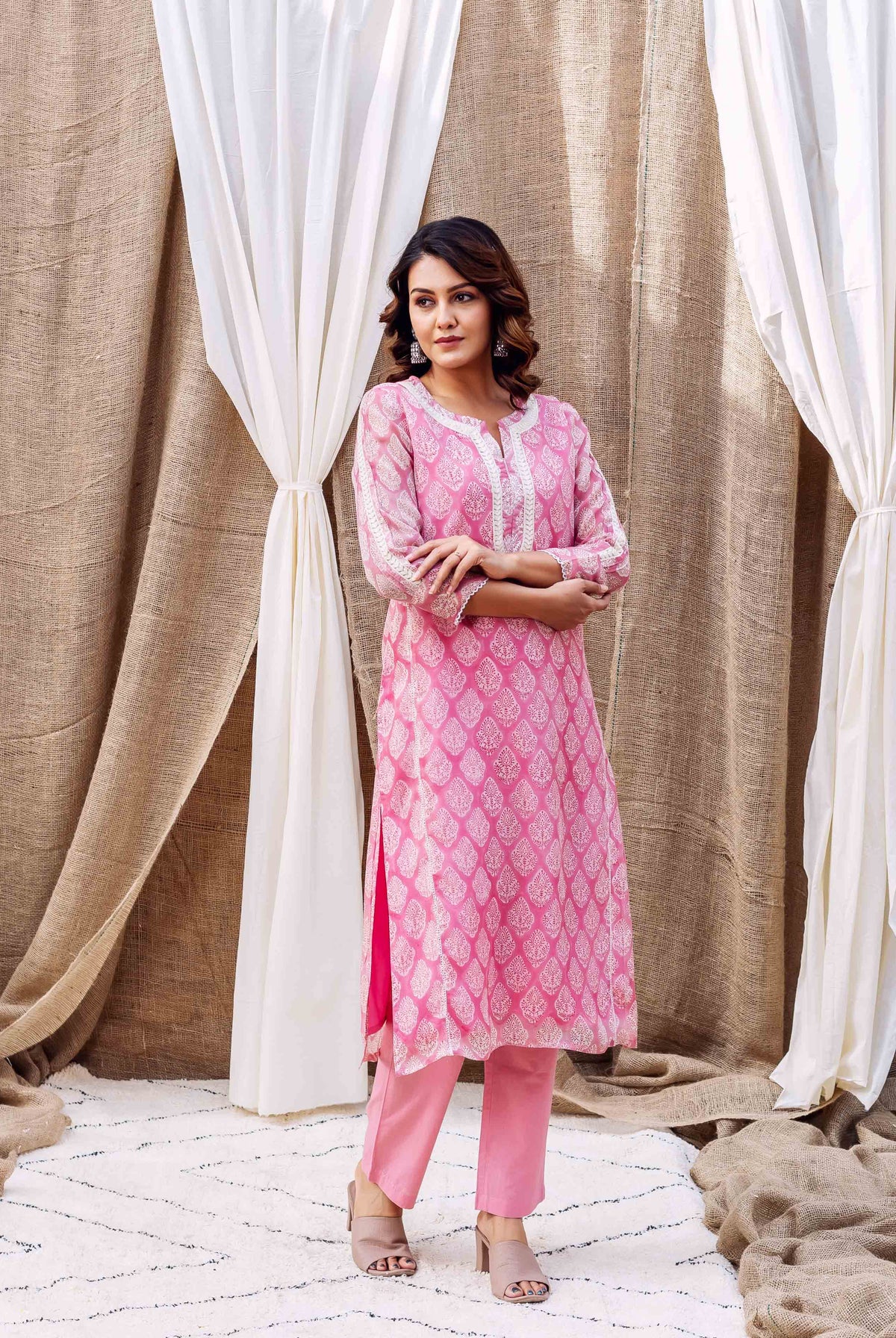 Model in Riya's blush pink hand-block-printed organza kurta and matching pants.
