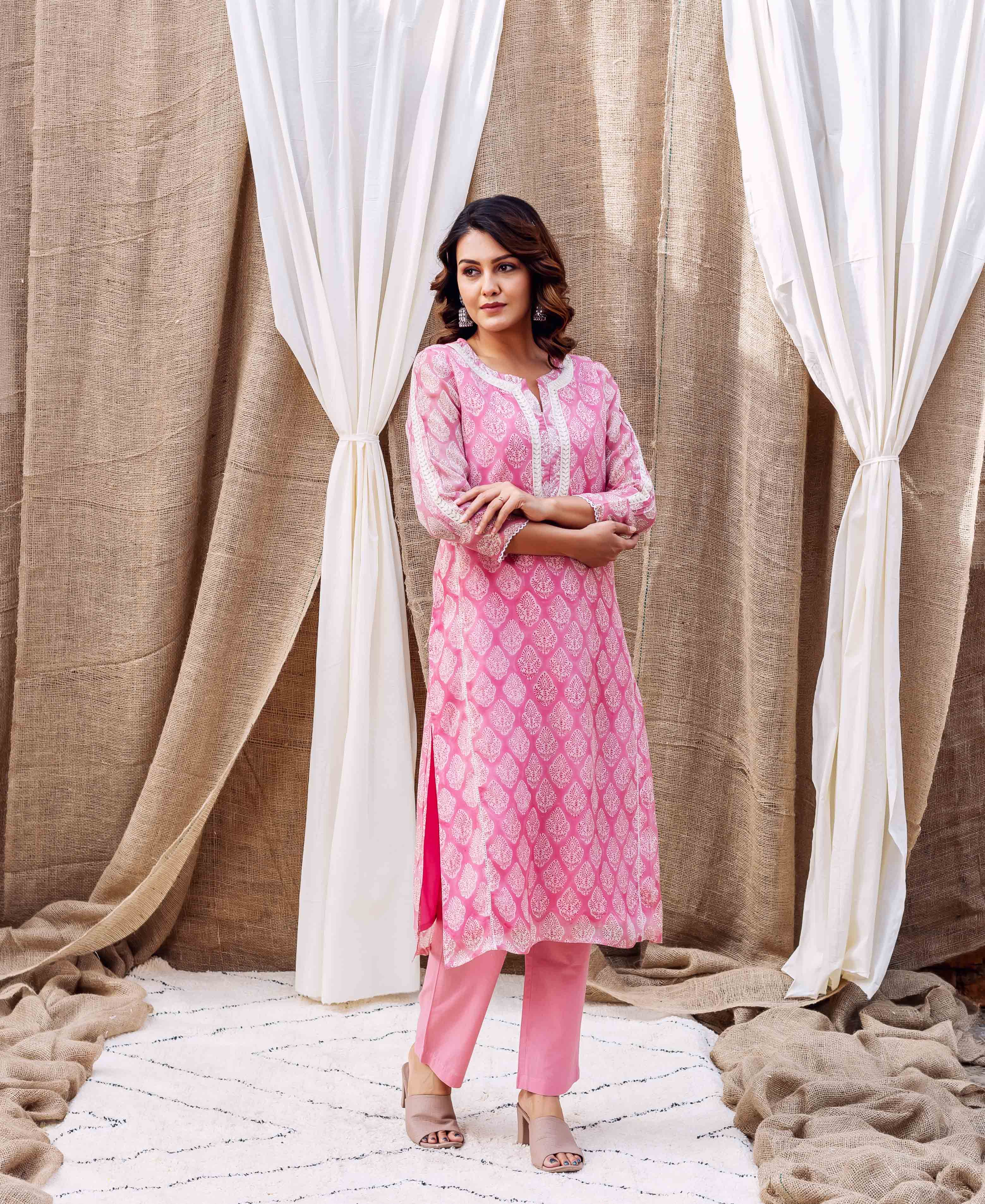 Model in Riya's blush pink hand-block-printed organza kurta and matching pants.