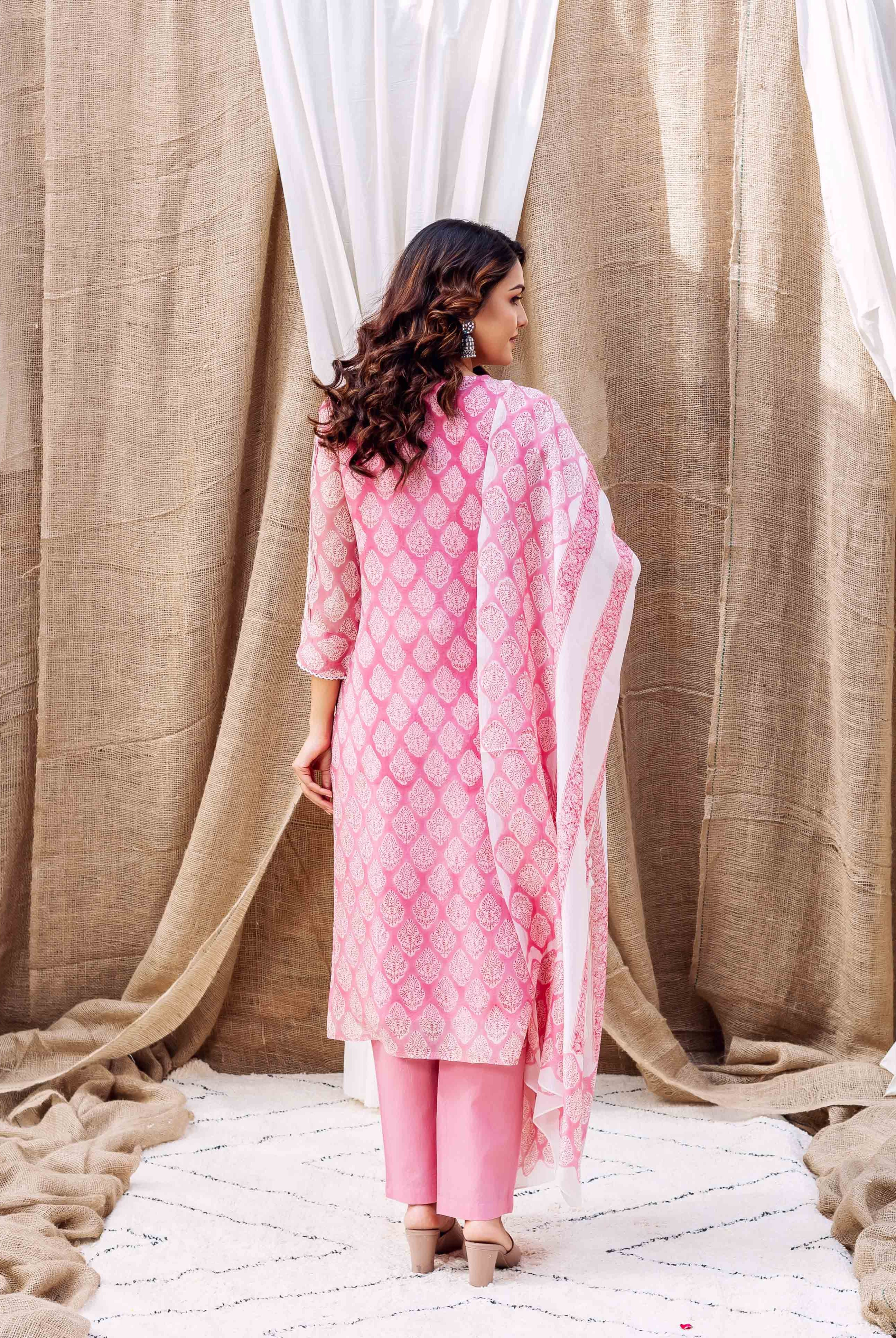 Back view: model in blush pink printed organza kurta, matching trousers, and dupatta.