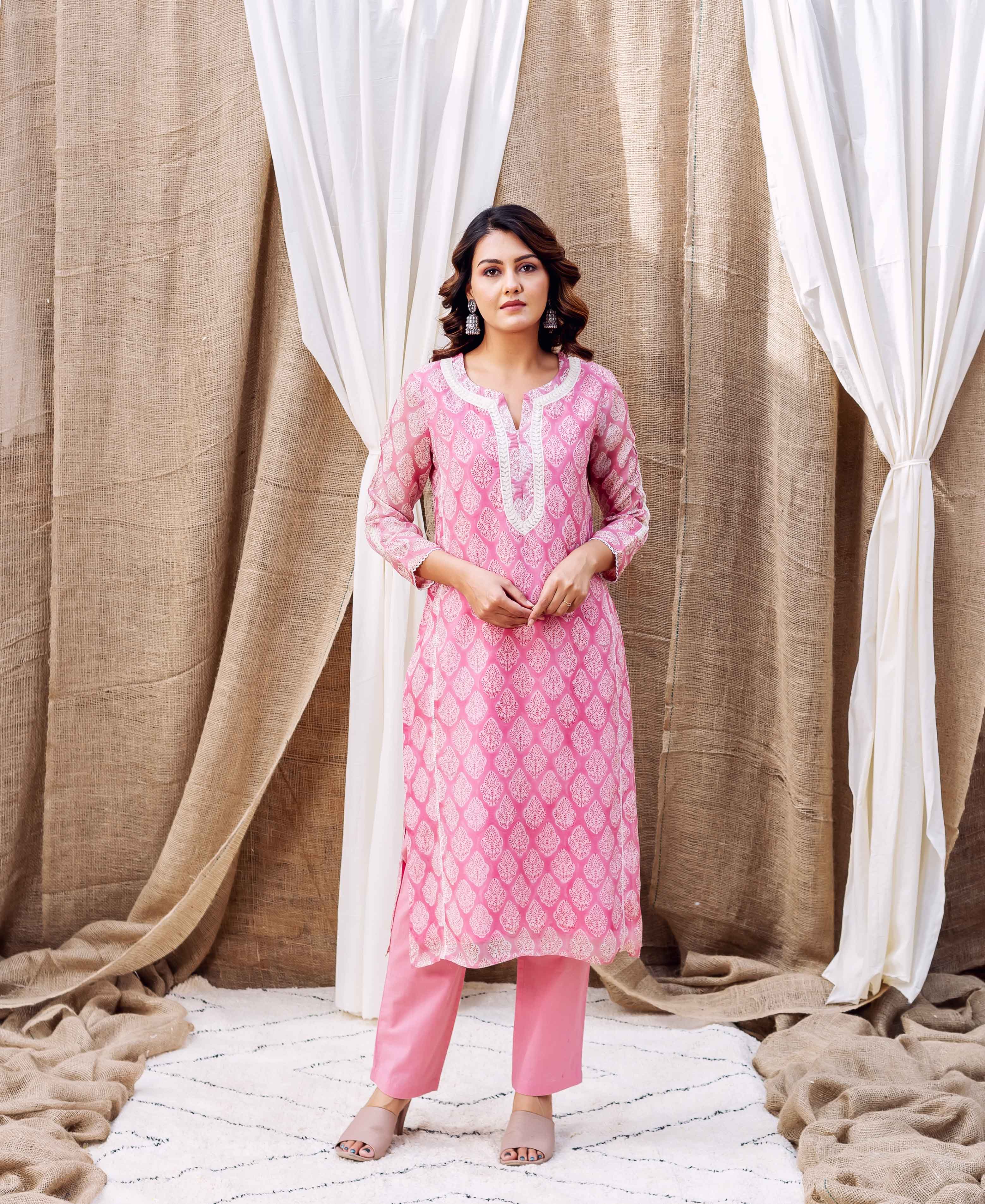 Blush pink hand-block-printed organza kurta with white print and matching pants worn by a model.